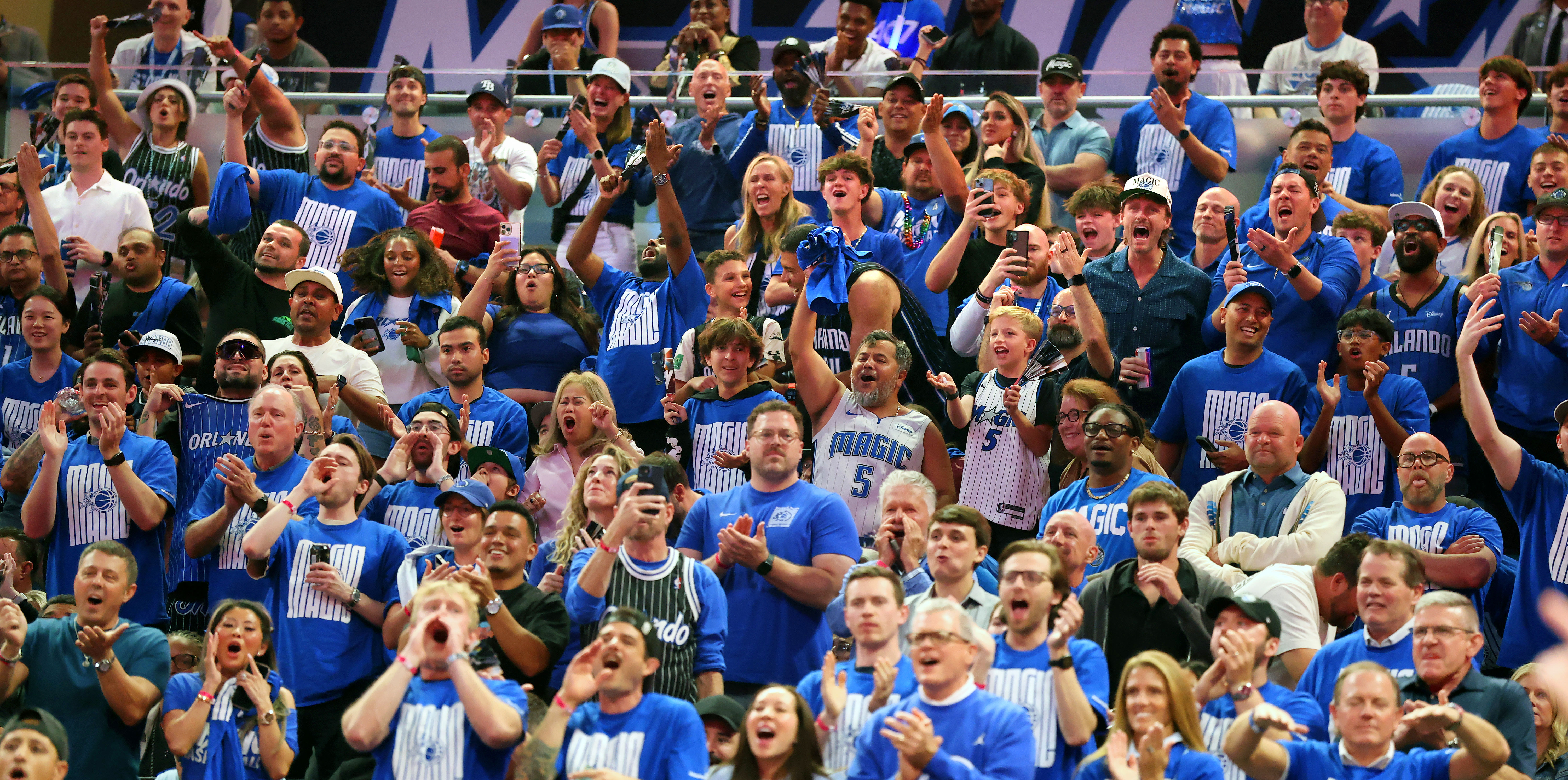 Orlando Magic fans cheer during Game 4 of the first-round...