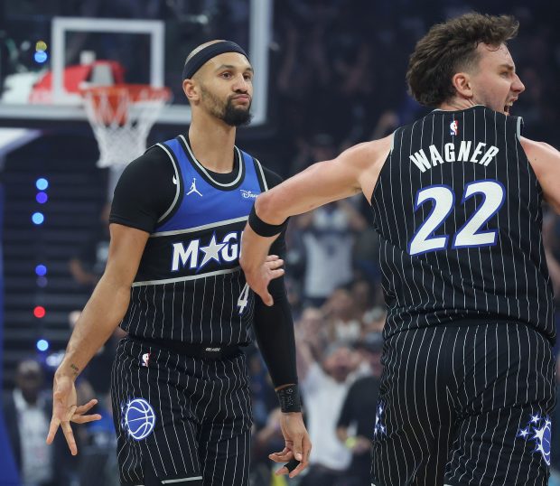 Orlando guard Jalen Suggs (4) and Orlando forward Franz Wagner (22) celebrate after a three point shot during the NBA Playoff Game 3 of Detroit Pistons at Orlando Magic at the Kia Center on Saturday, April 25, 2026. (Stephen M. Dowell/Orlando Sentinel)