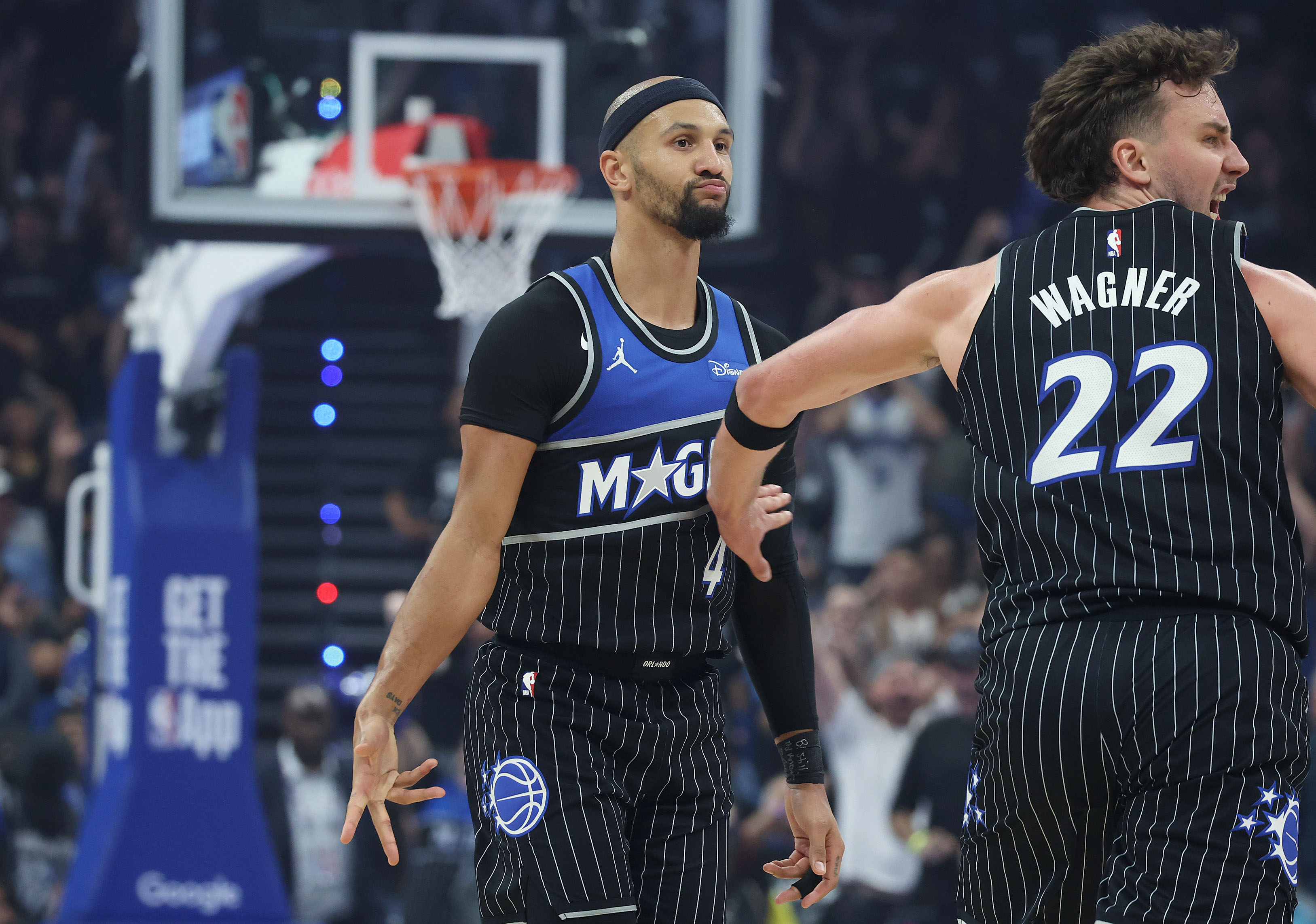 Orlando guard Jalen Suggs (4) and Orlando forward Franz Wagner...