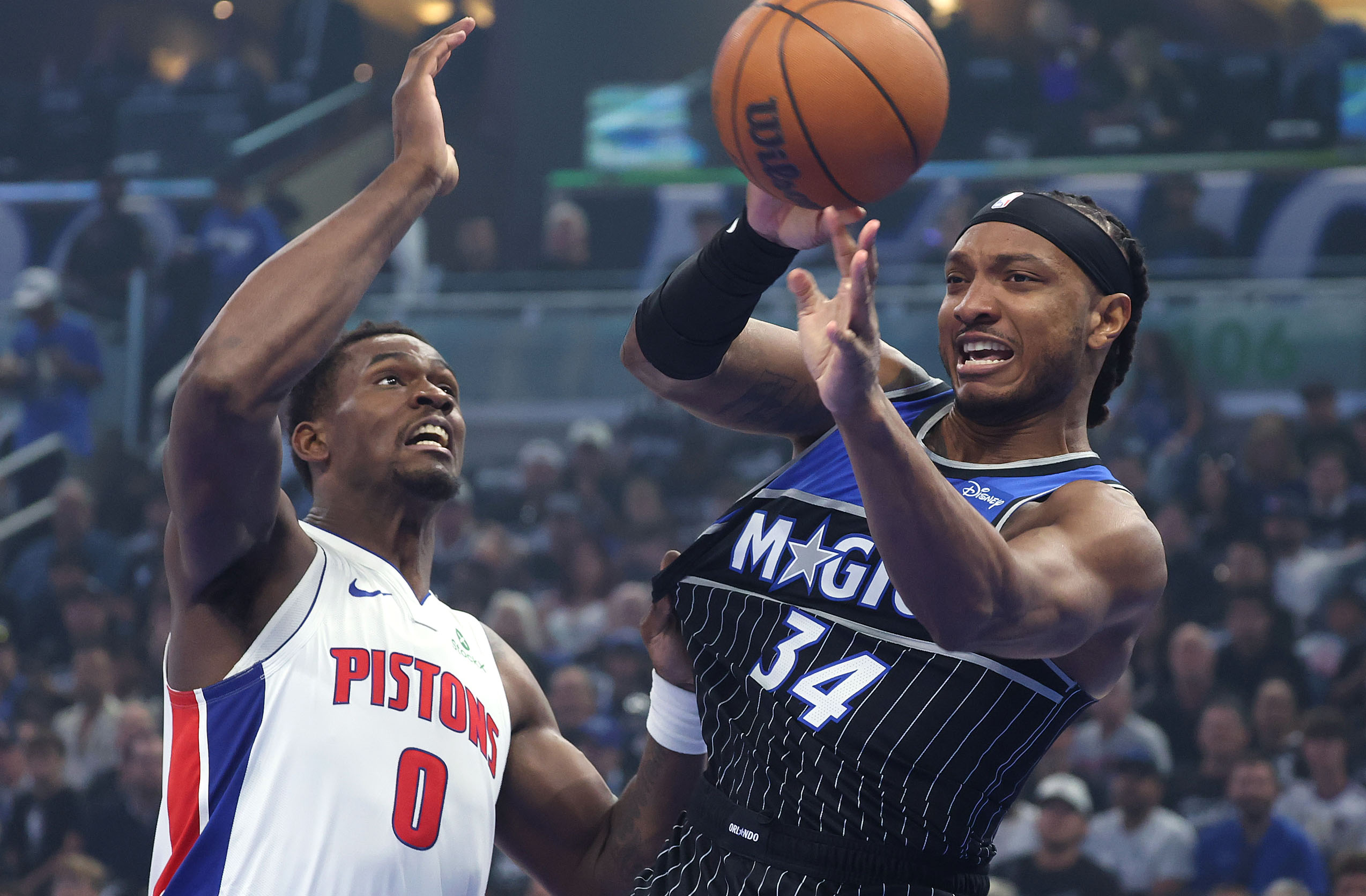 Orlando center Wendell Carter Jr. (34) passes around Detroit center...