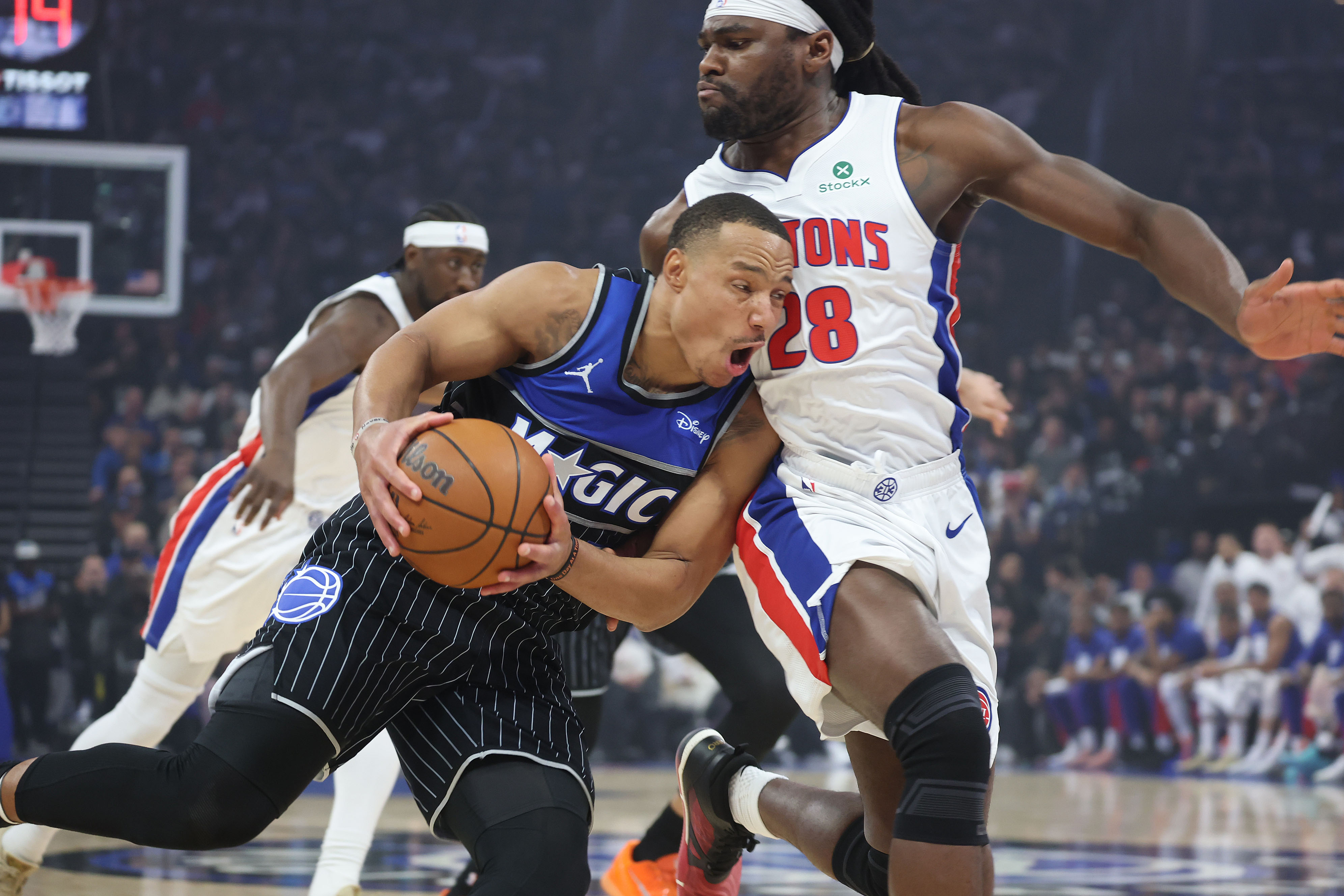 Orlando guard Desmond Bane (3) runs into Detroit Isaiah Stewart...