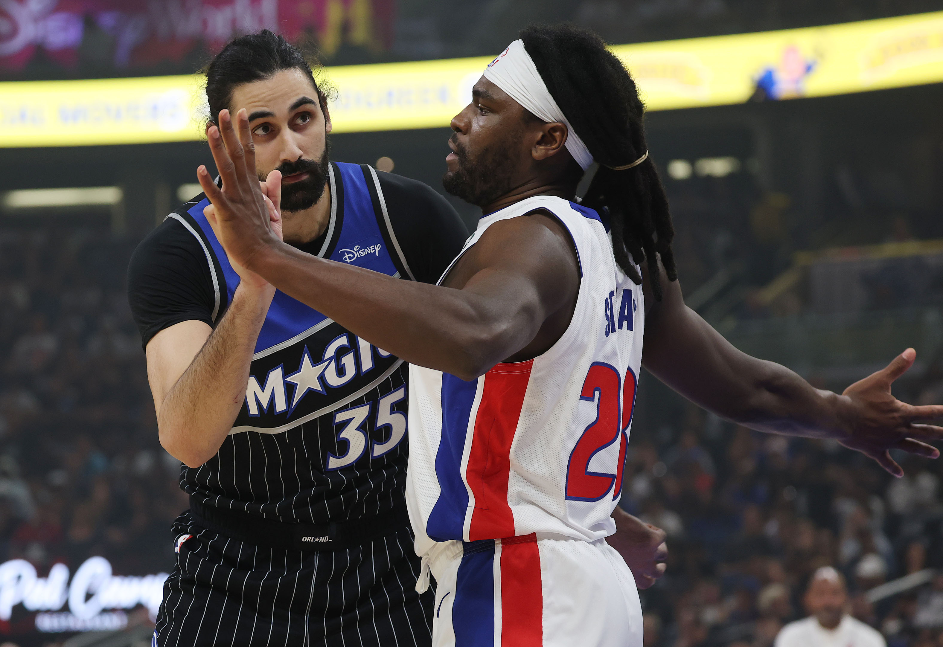 Detroit forward Isaiah Stewart (28) and Orlando center Goga Bitadze...