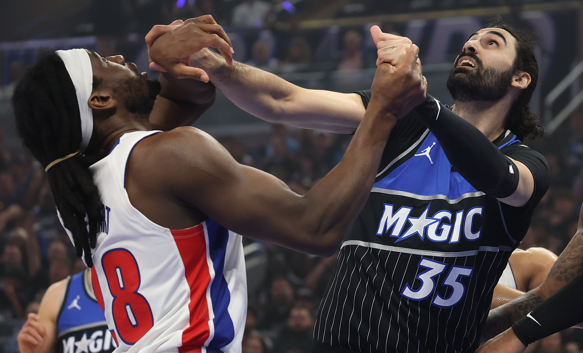 Detroit forward Isaiah Stewart (28) and Orlando center Goga Bitadze...