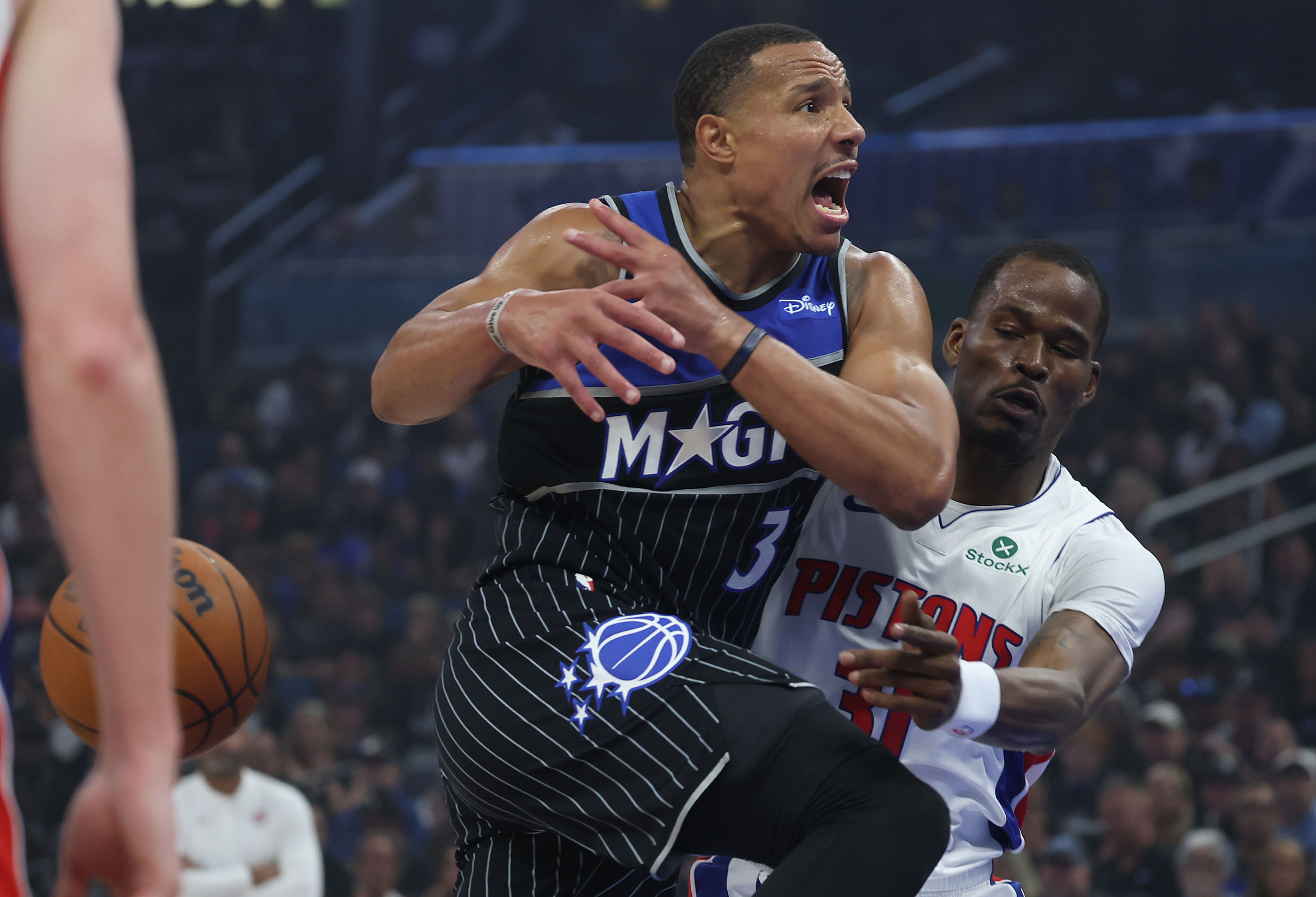 Orlando guard Desmond Bane (3) loses the ball to Detroit...
