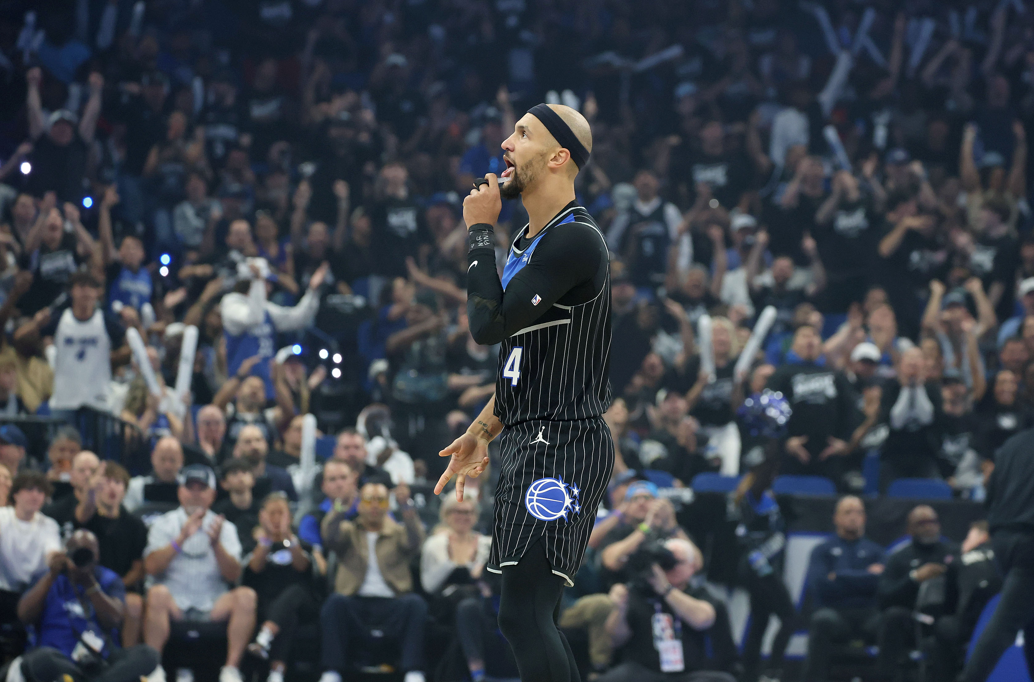 Orlando guard Jalen Suggs celebrates after a three point shot...