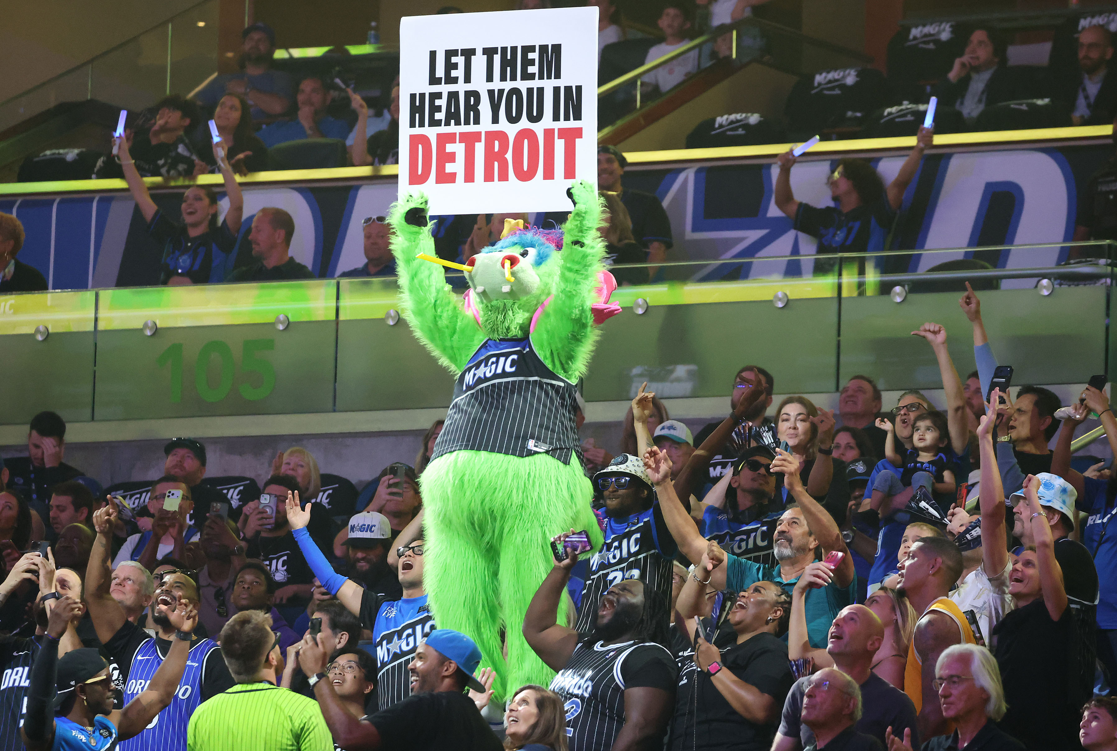Orlando mascot STUFF cheers with fans during the NBA Playoff...