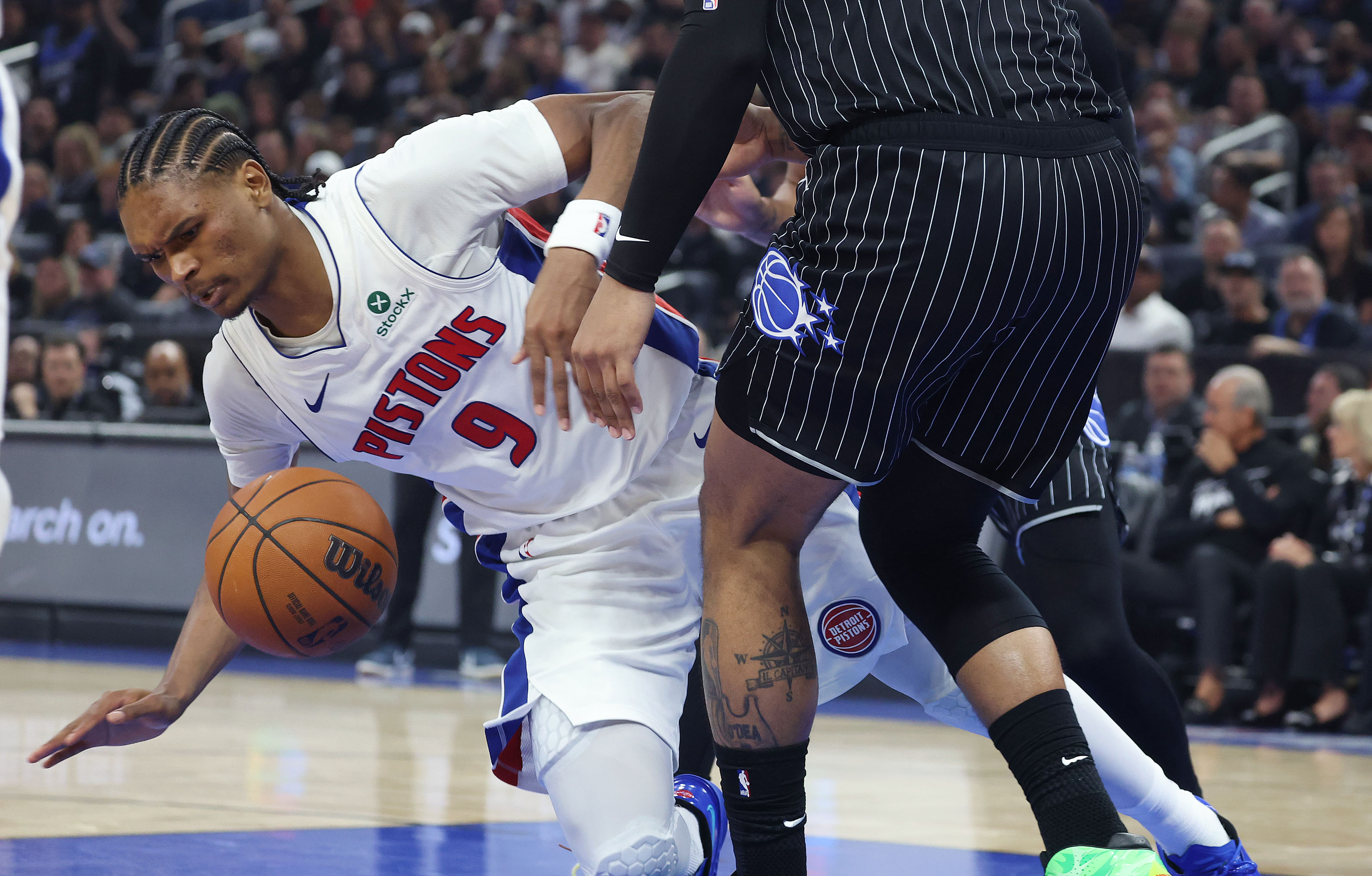 Detroit forward Ausar Thompson falls during the NBA Playoff Game...