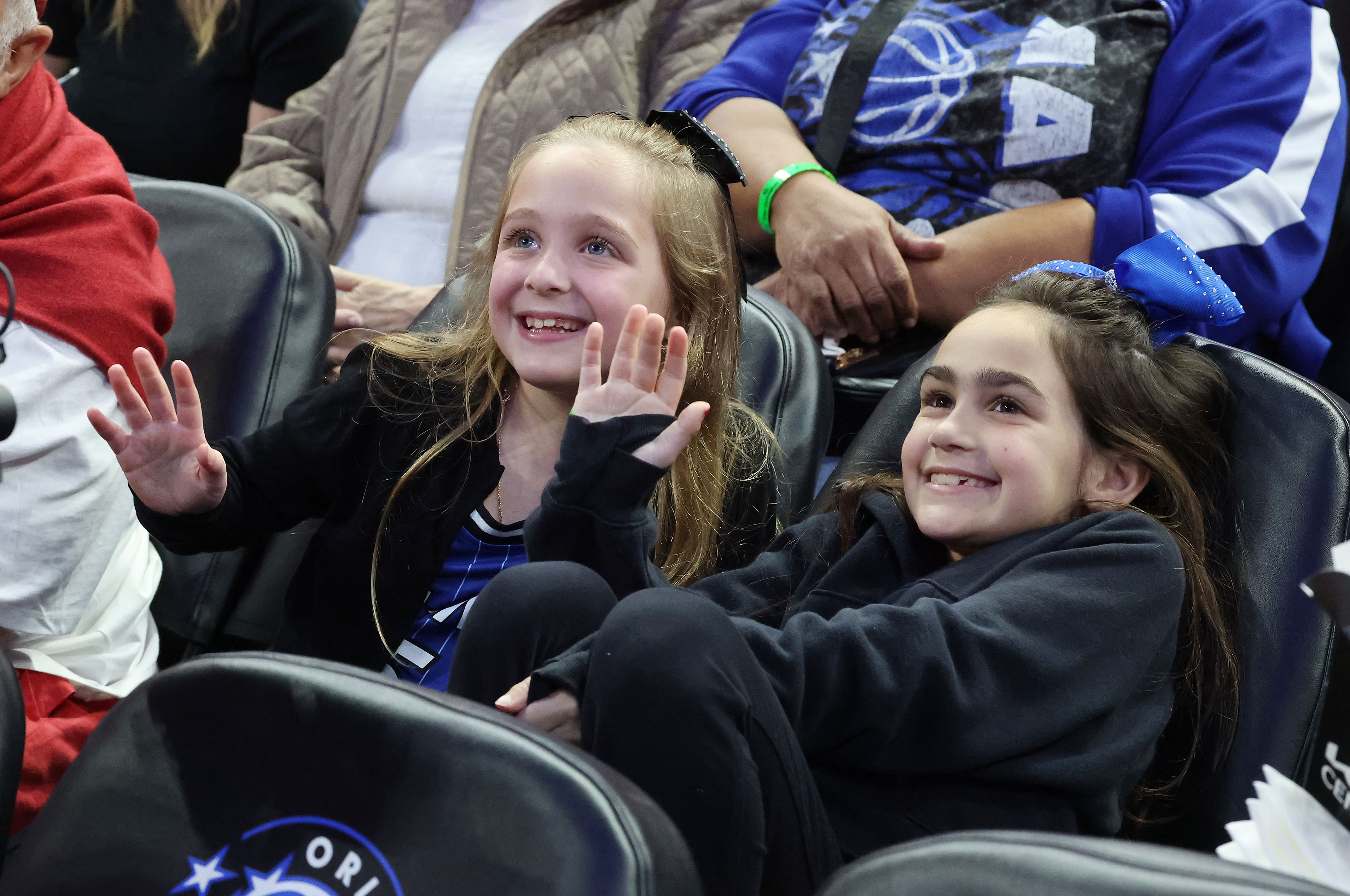 Orlando fans wave to the big screen tv during the...