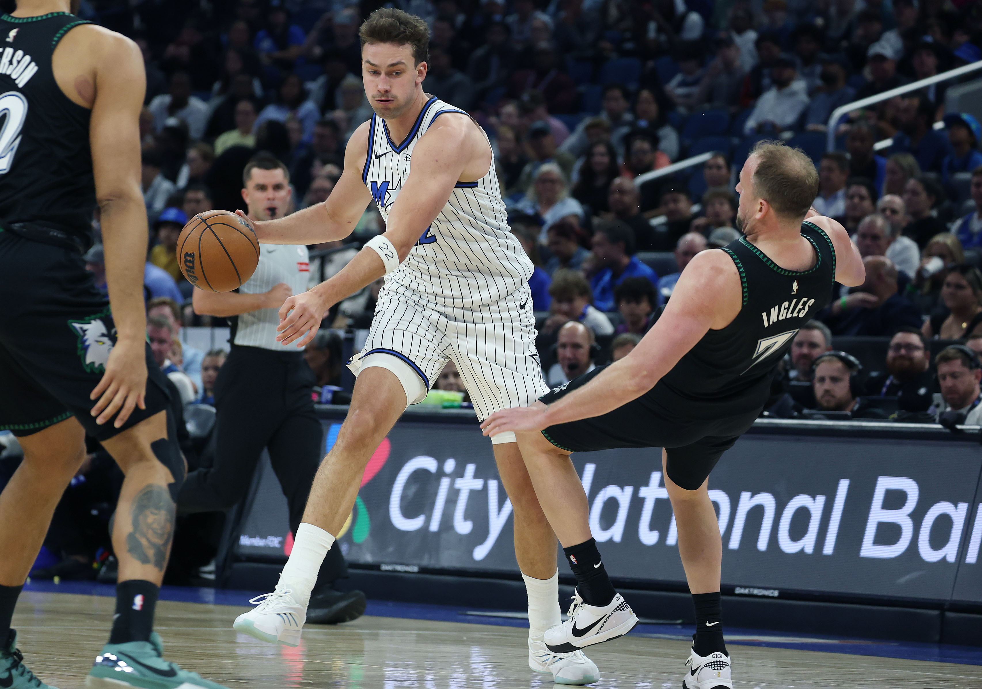 Minnesota forward Joe Ingles (7) falls down while guarding Orlando...