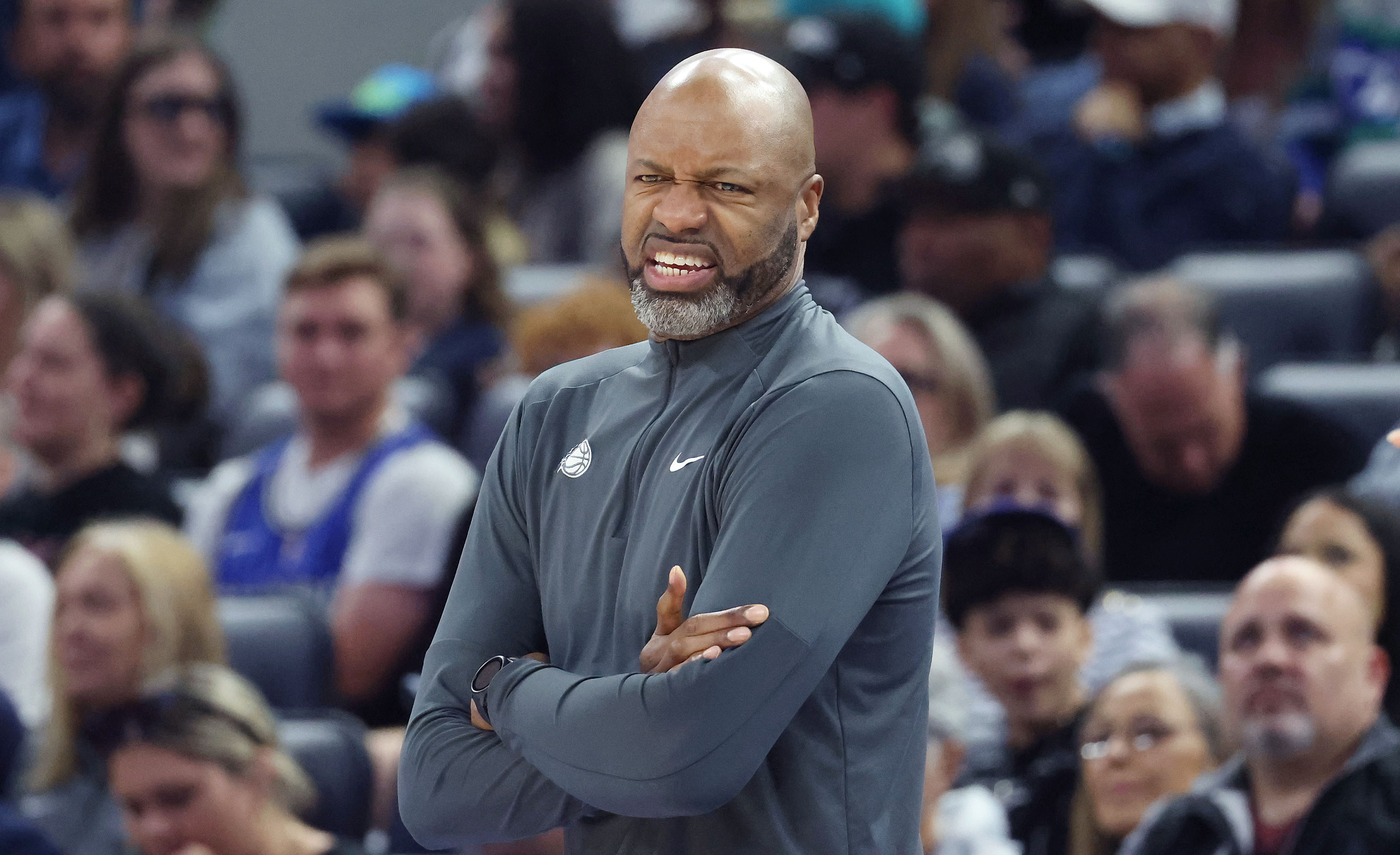 Orlando coach Jamahl Mosley makes a face during the Minnesota...