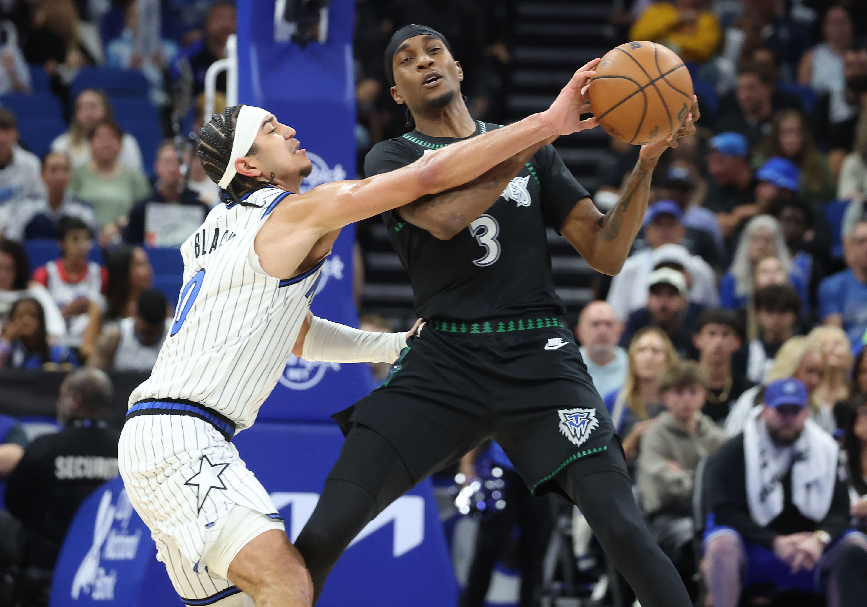 Orlando guard Anthony Black (0) gets a hand on the...