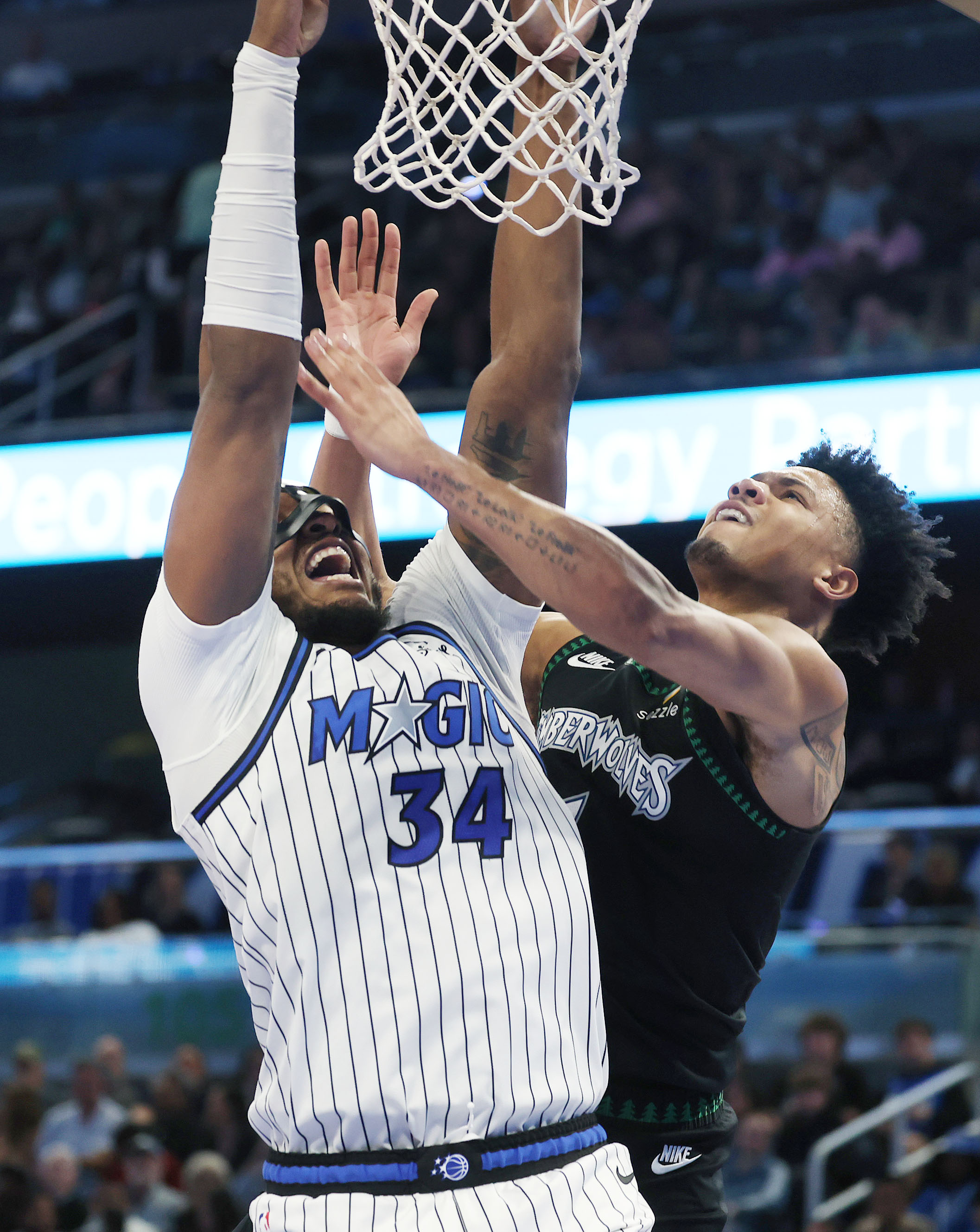 Orlando center Wendell Carter Jr. (34) scores past Minnesota guard...