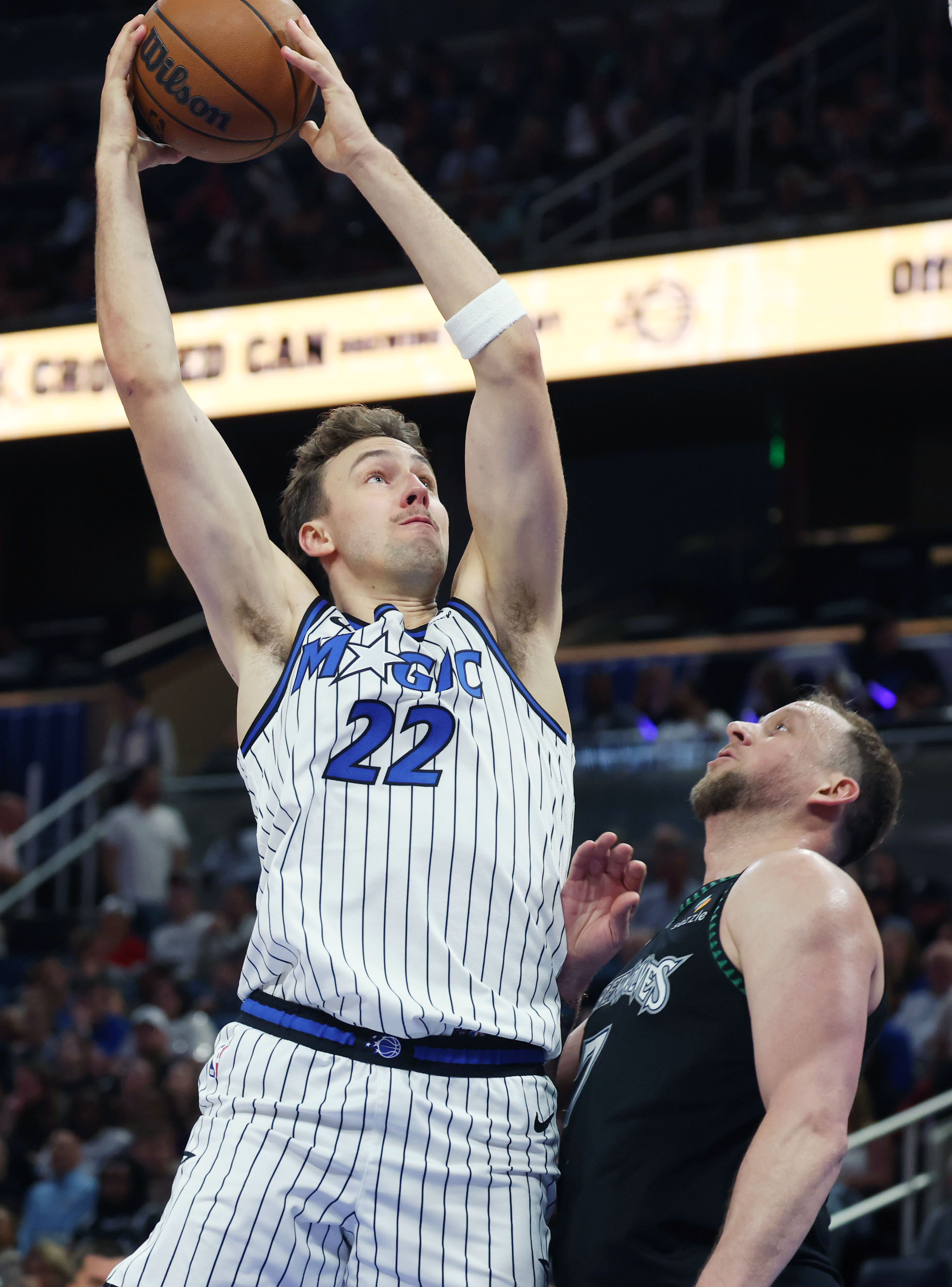 Orlando forward Franz Wagner (22) pulls in a rebound over...
