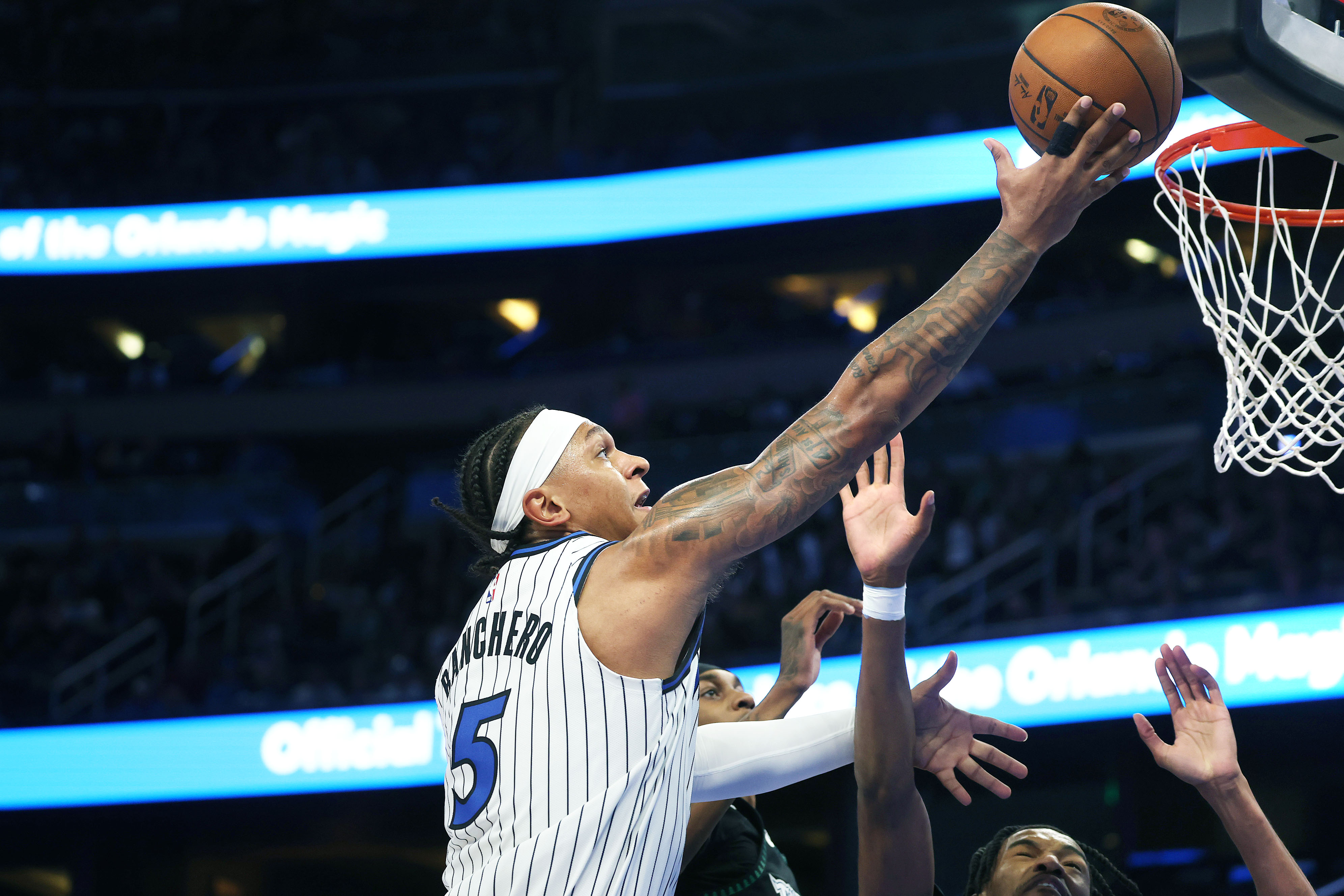 Orlando forward Paolo Banchero (5) scores during the Minnesota Timberwolves...