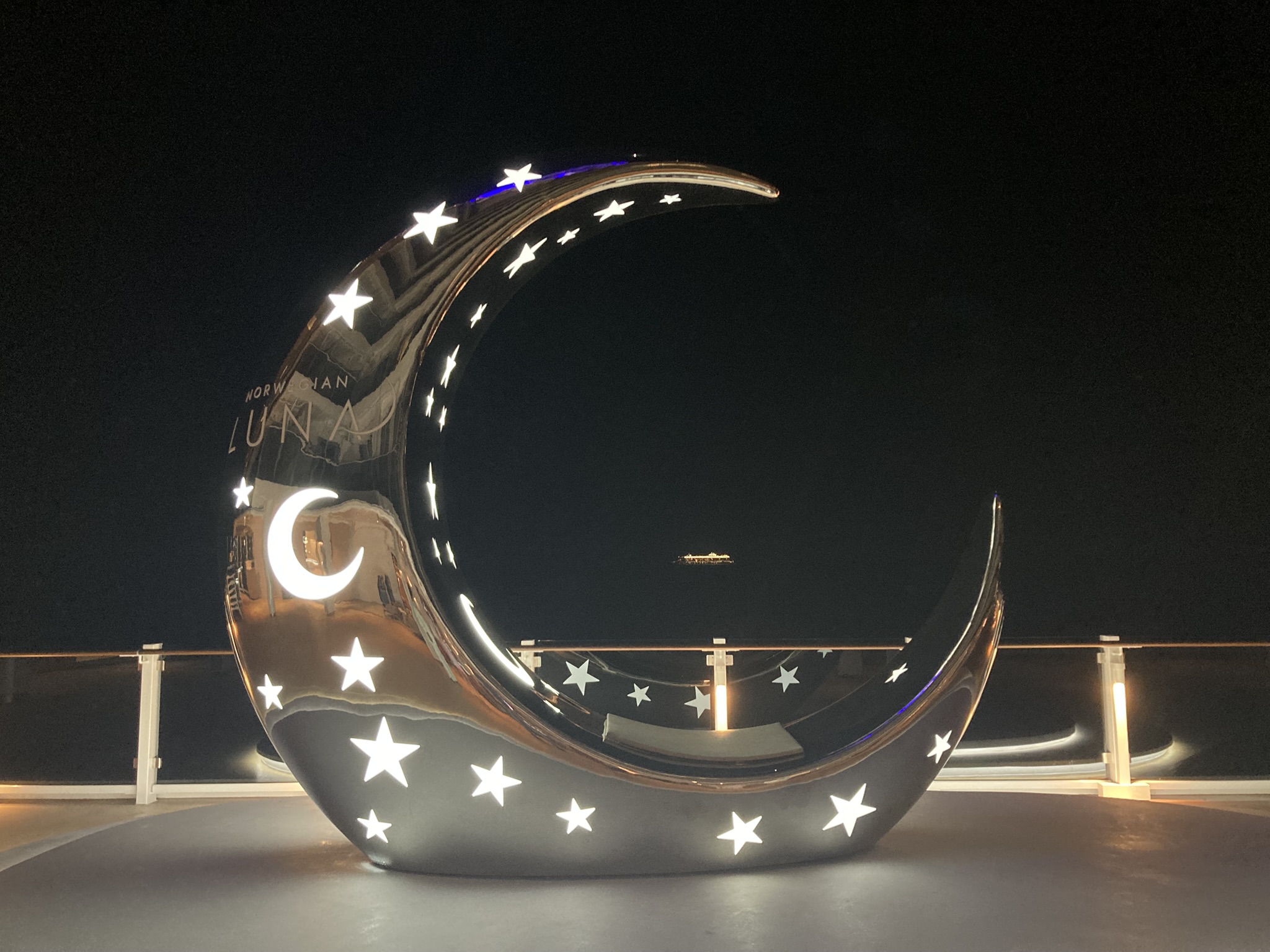 The signature sculpture of a crescent moon is seen on...