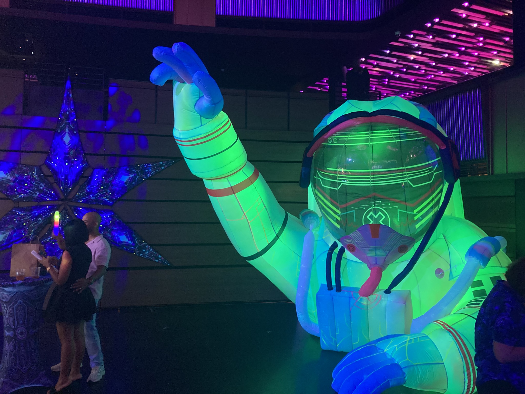 A massive astronaut prop glows during the Luna Eclipse Party...