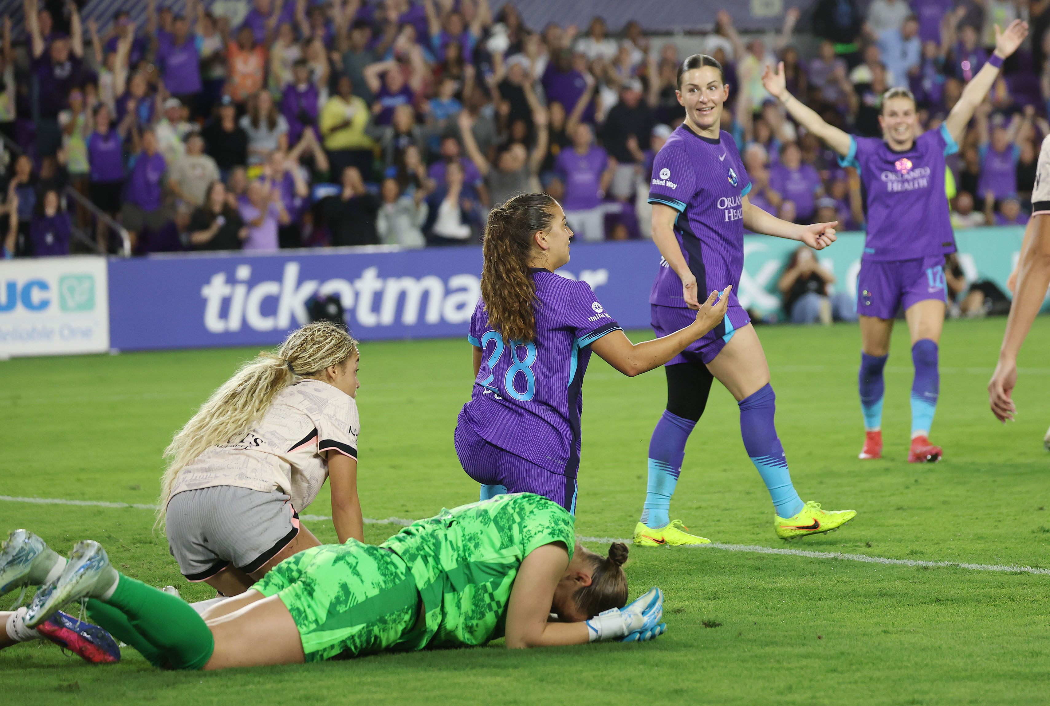 Pride players celebrate after Haley McCutcheon (middle) scored a goal...