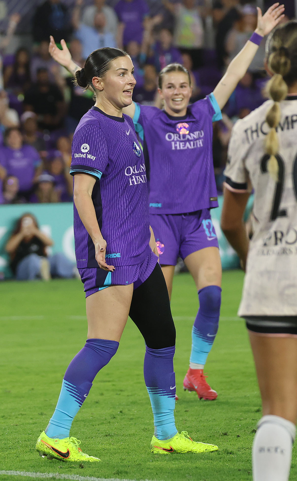 Pride players Haley McCutcheon (left) and Cori Dyke (12) celebrate...