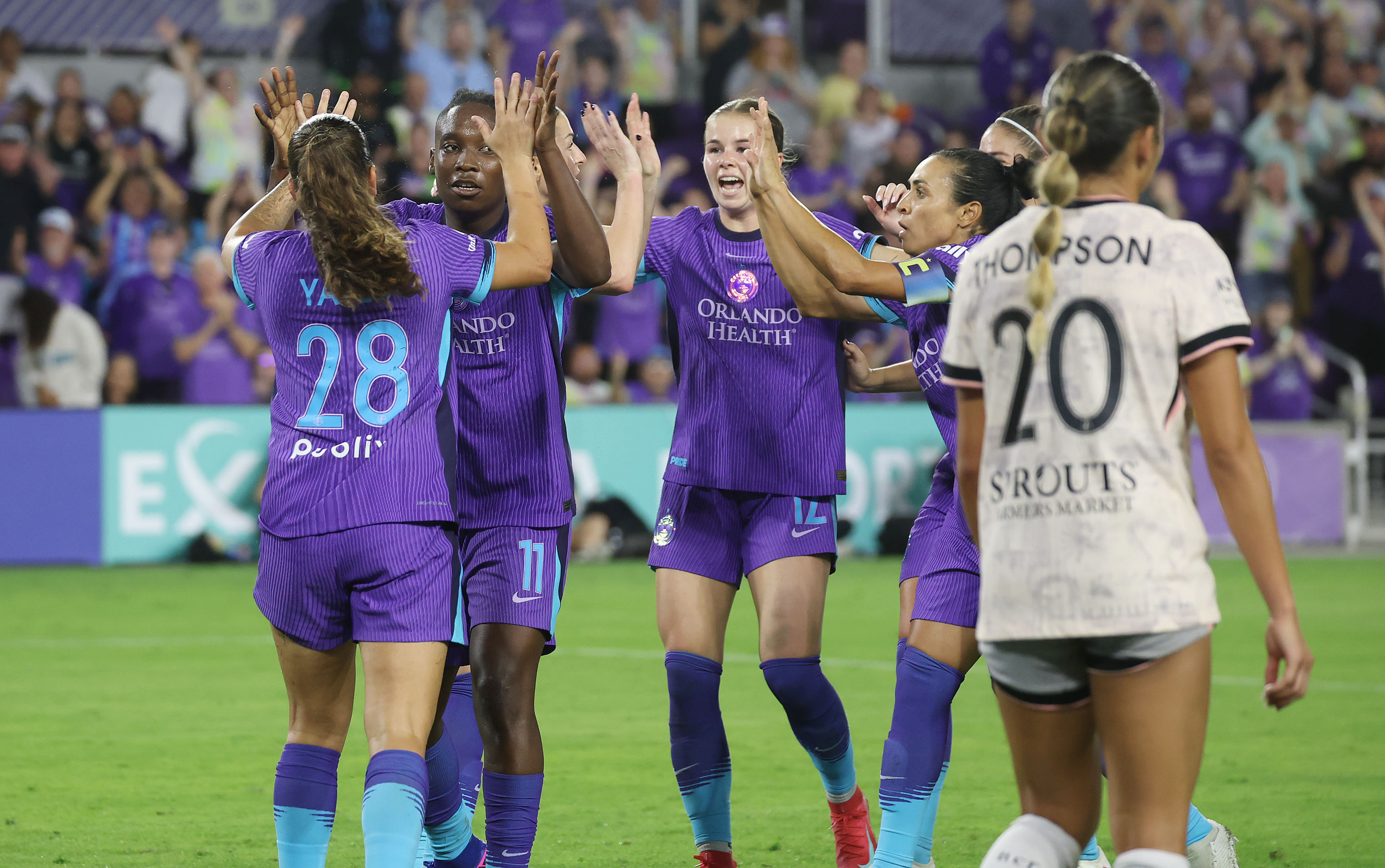 Pride players celebrate after a goal during the Angel City...