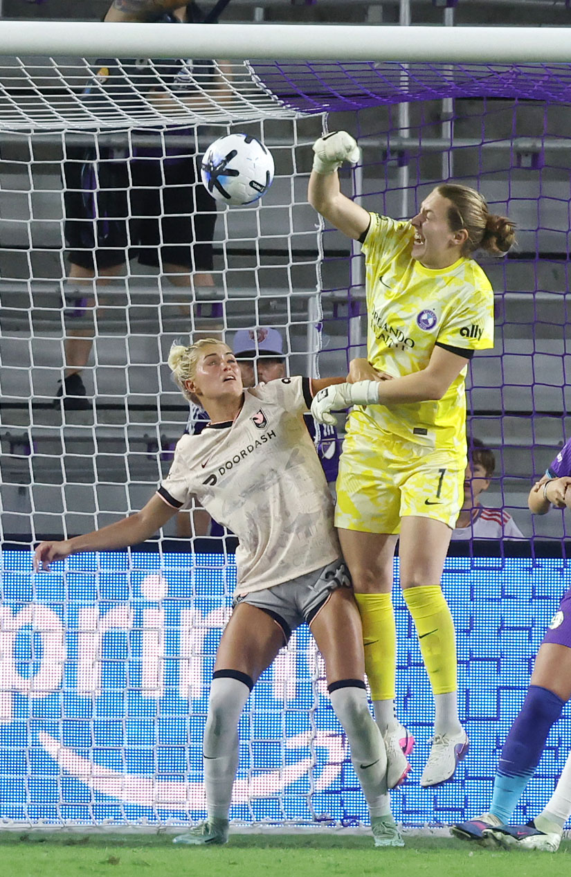 Pride goalkeeper Anna Moorhouse (1) knocks the ball away from...