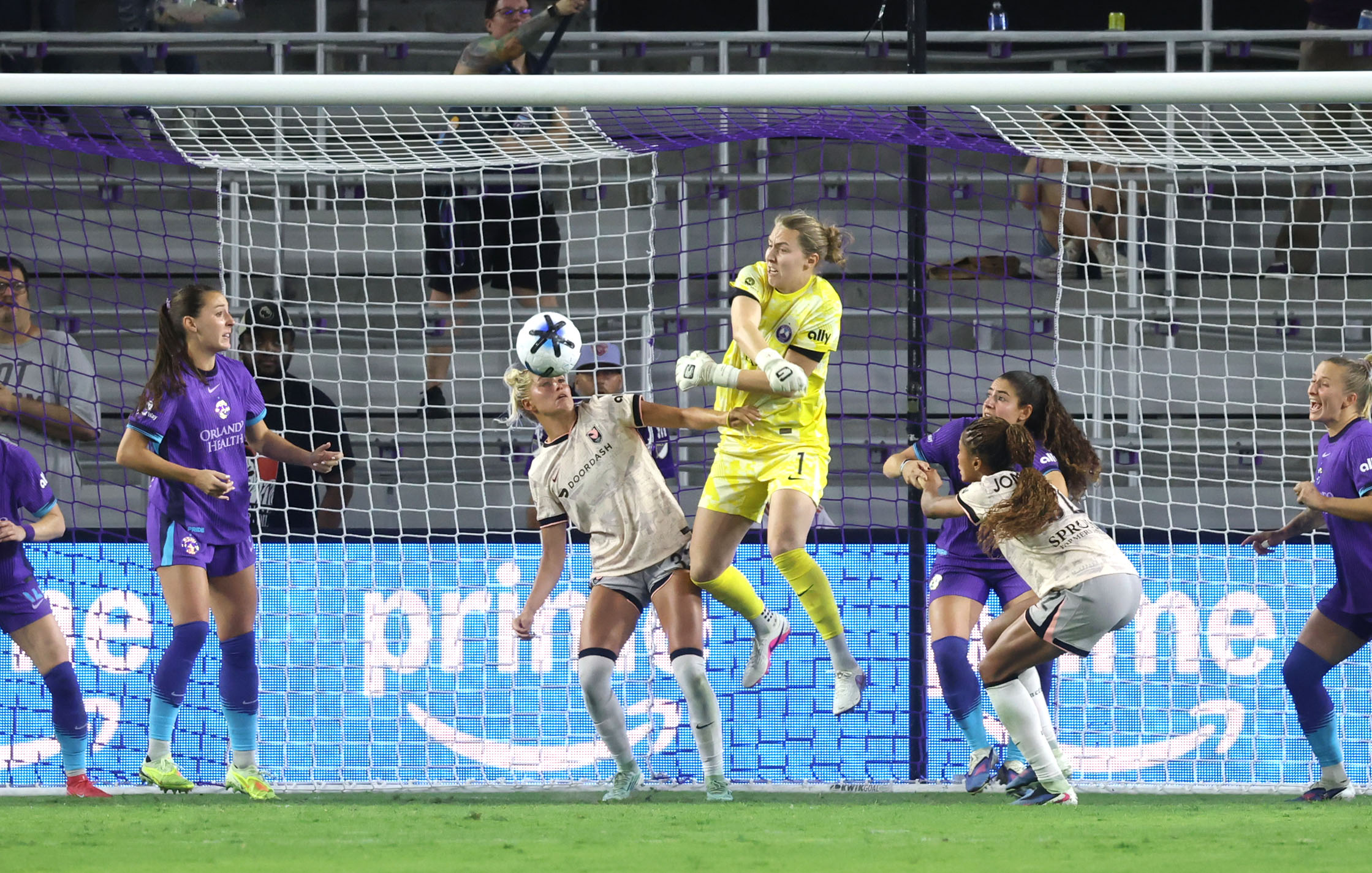Pride goalkeeper Anna Moorhouse (1) swats the ball away from...