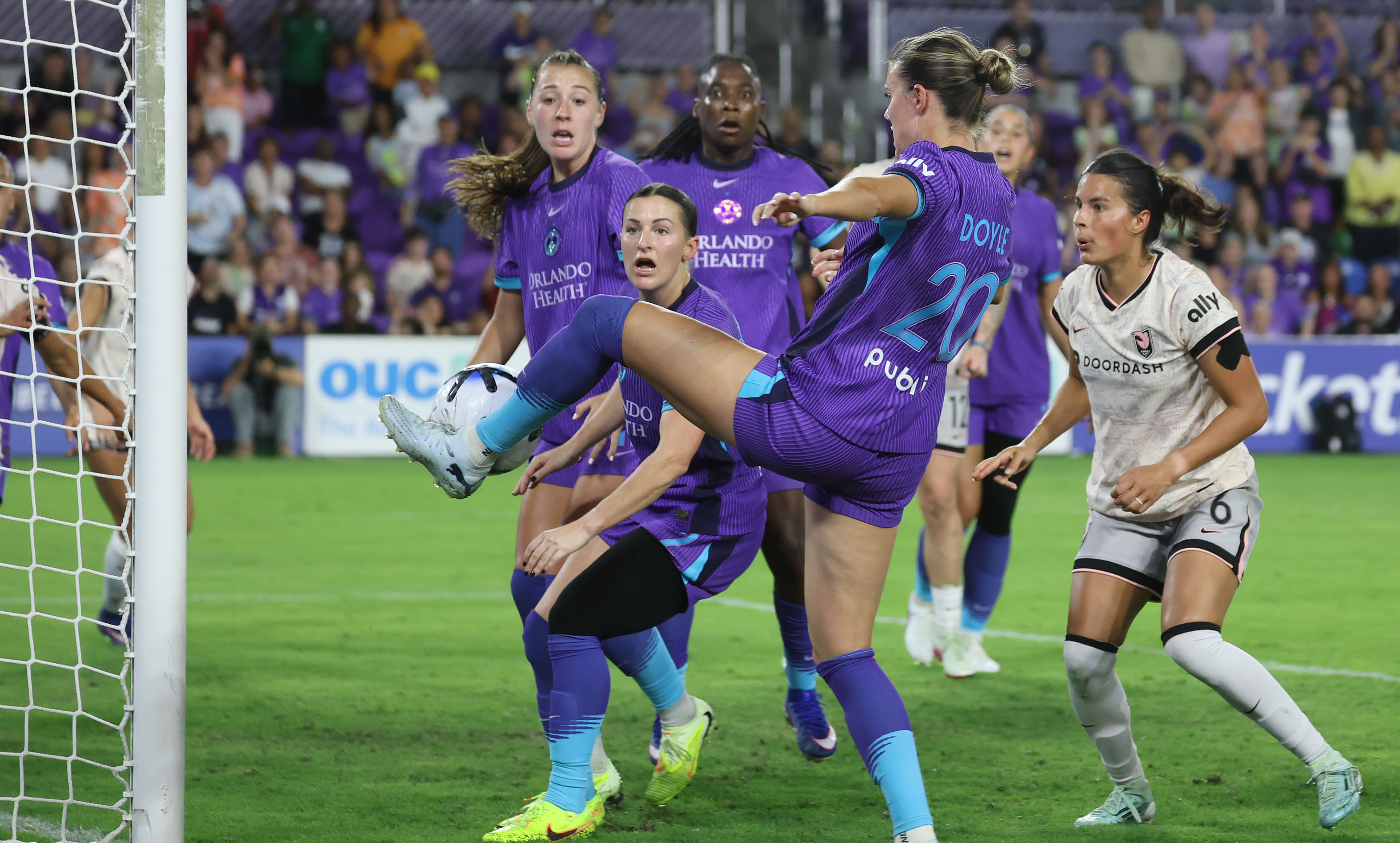Pride player Julie Doyle (20) kicks the ball toward Pride...