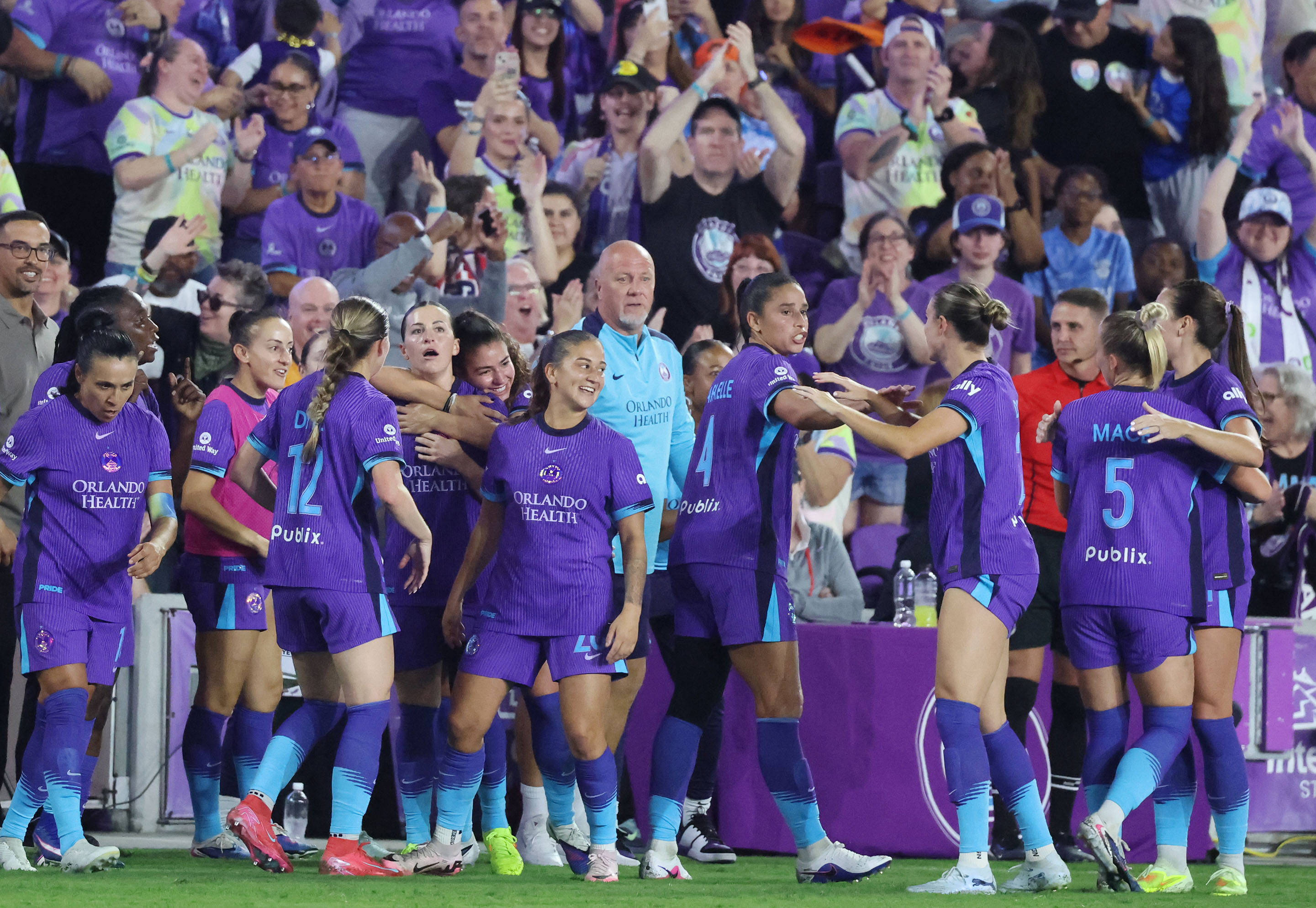 Pride players celebrate after a goal during the Angel City...