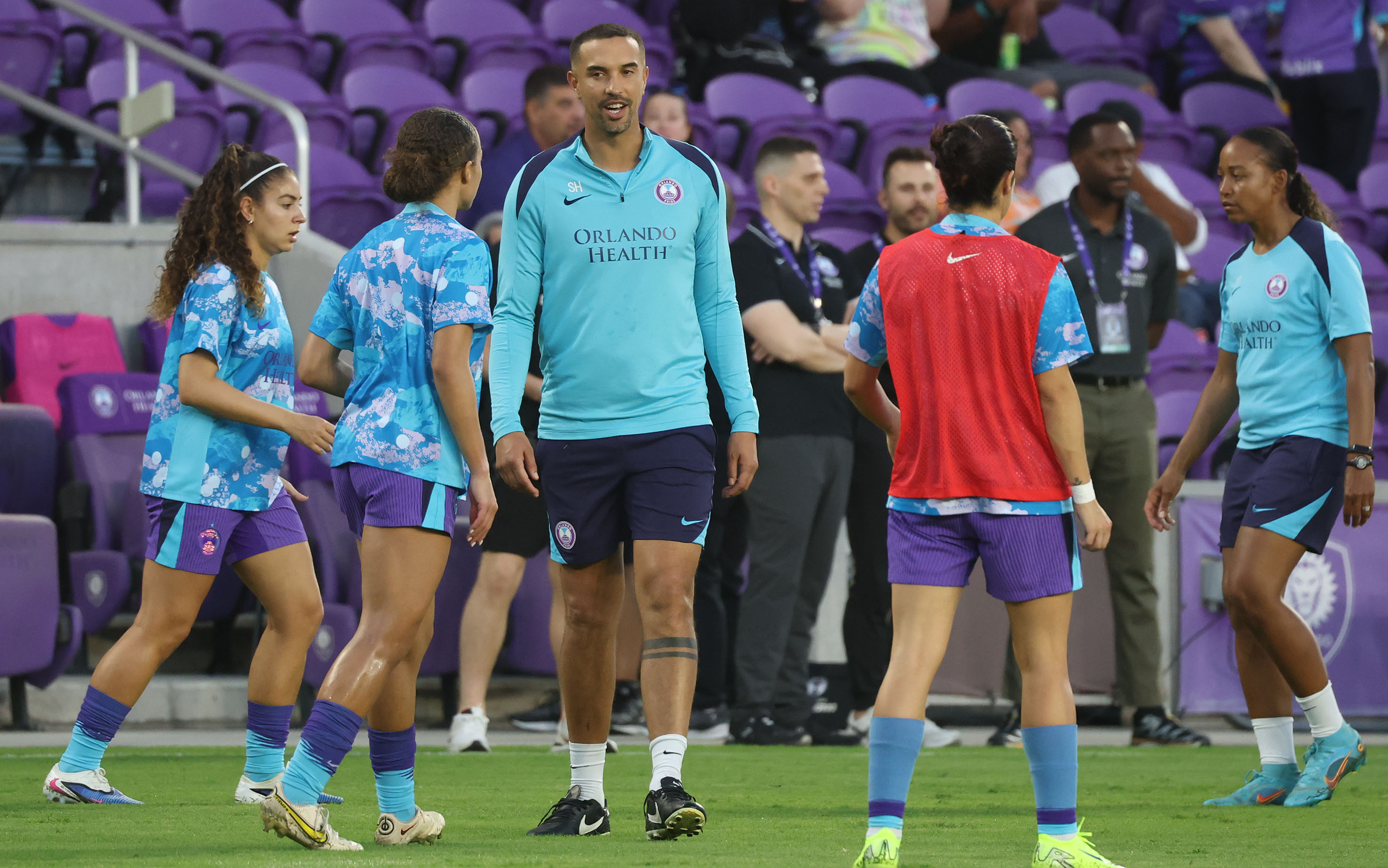 Pride head coach Seb Hines coaches players before the Angel...