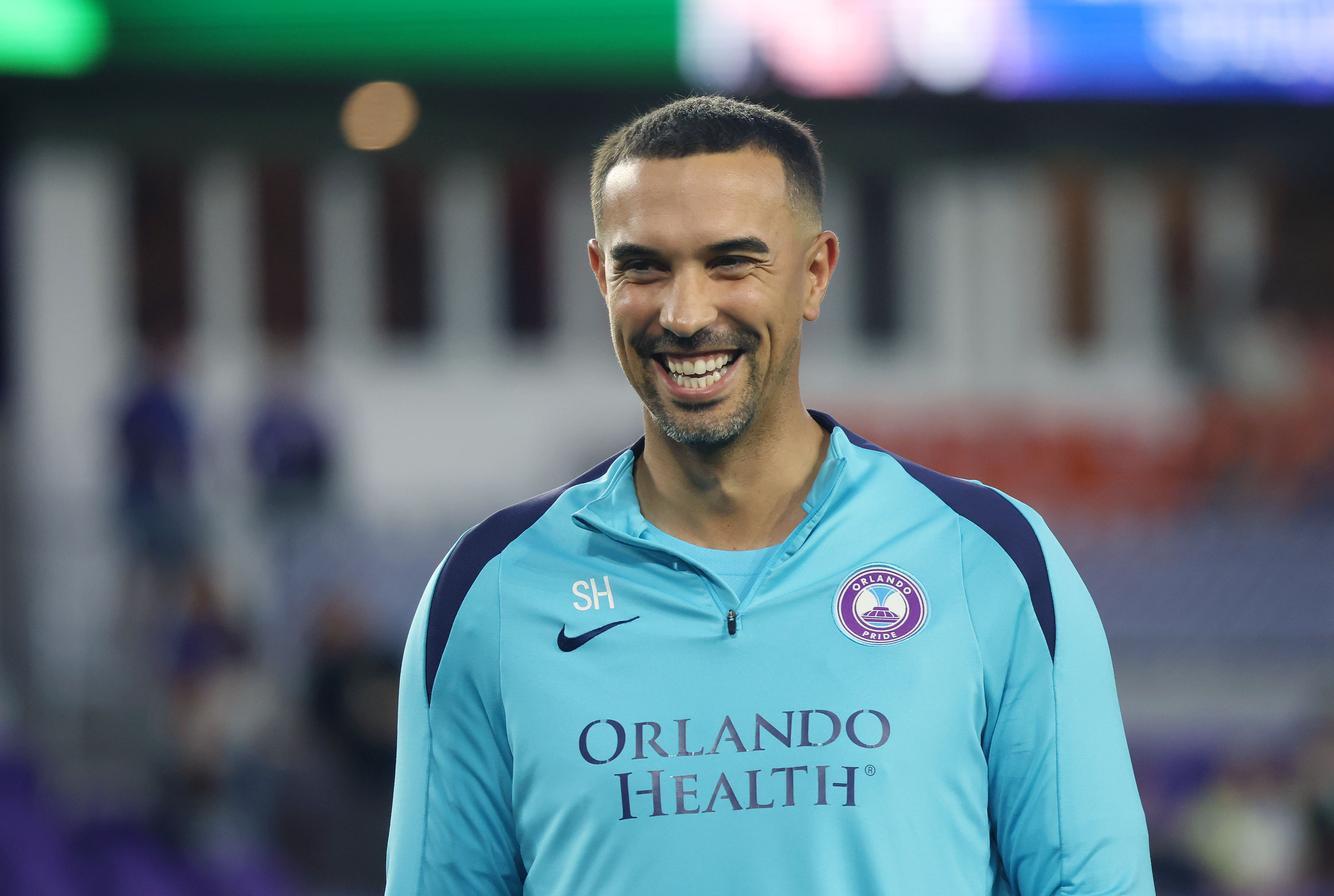 Pride coach Seb Hines smiles before the Angel City FC...
