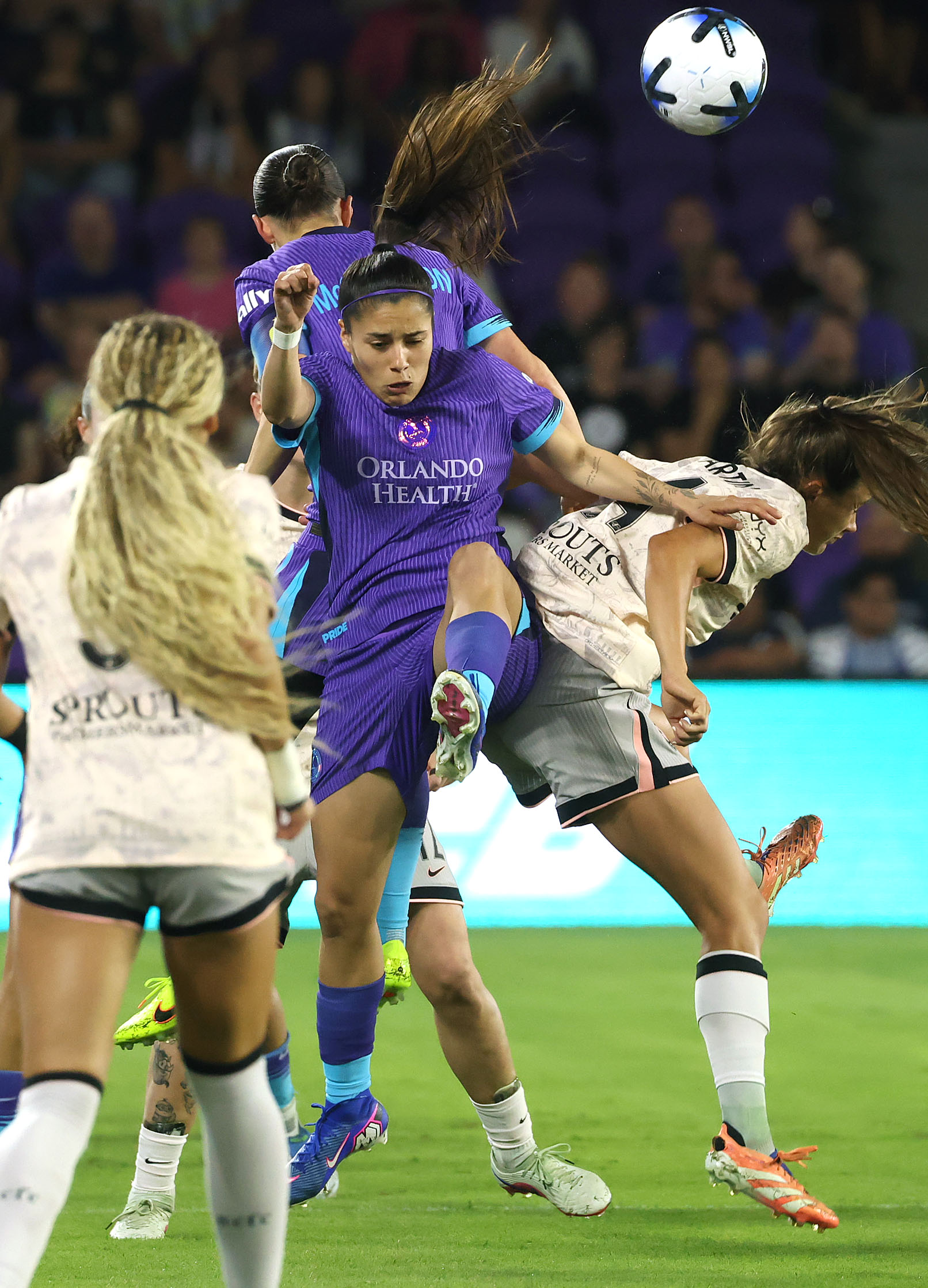 Pride player Jacqueline Ovalle (middle) leaps during the Angel City...