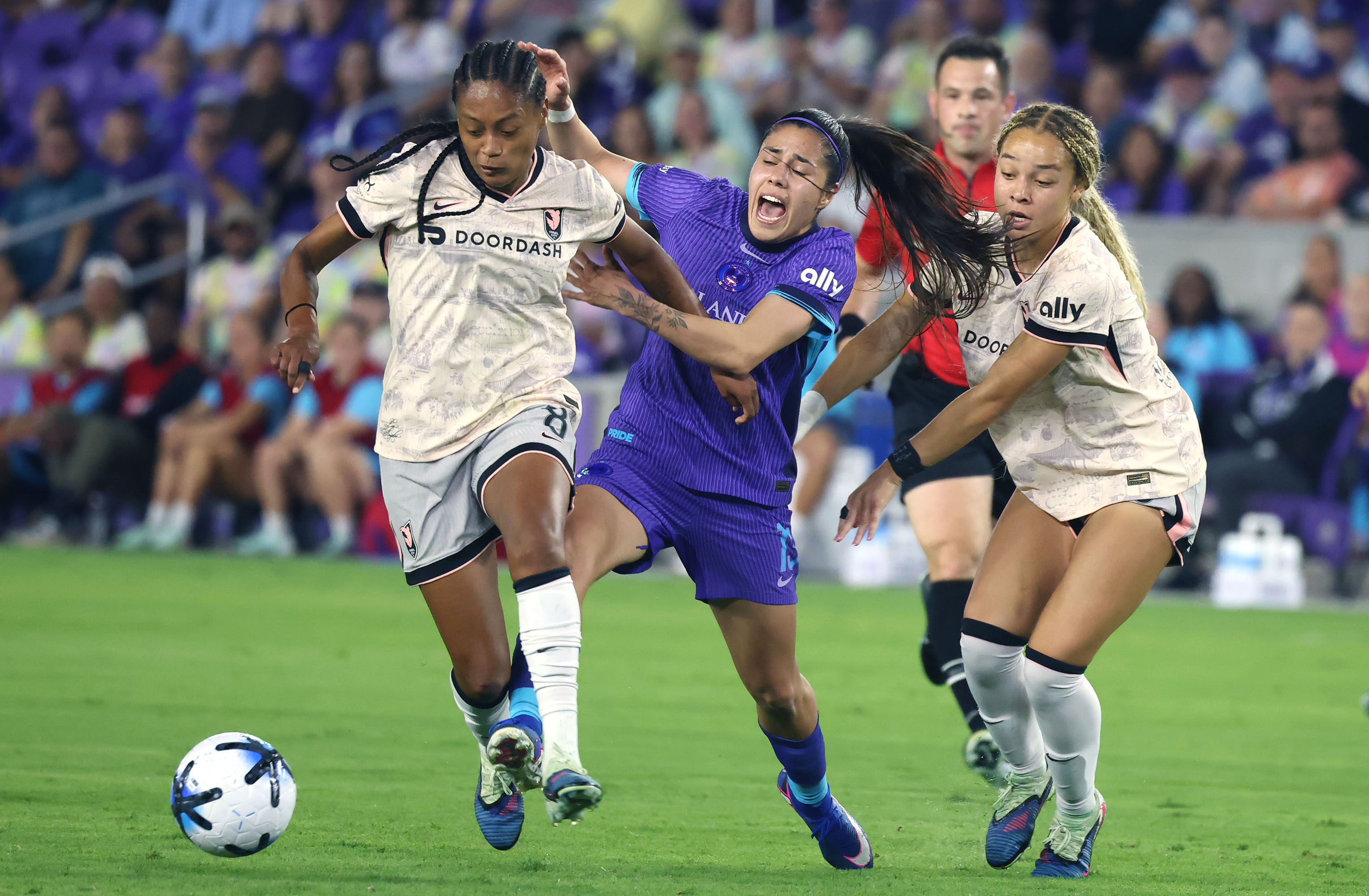Pride player Jacqueline Ovalle (middle) battles Angel City player Ary...