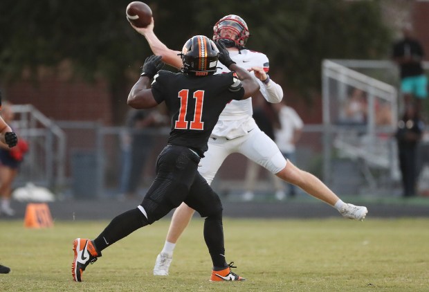 Talented Lake Brantley quarterback Jackson Stecher can throw the ball in many ways ... off his back foot, front foot, falling down, scrambling out of bound or under intense pressure. (Stephen M. Dowell/Orlando Sentinel)