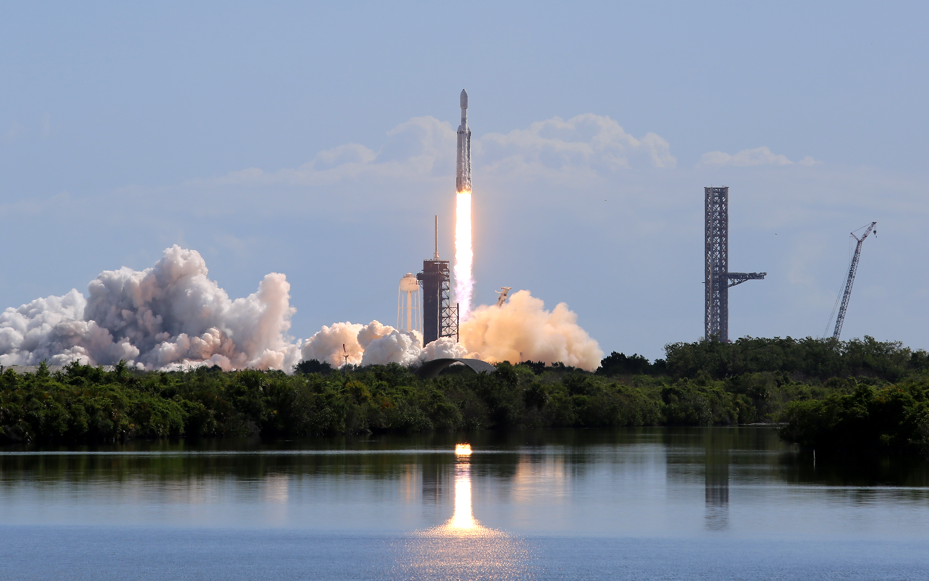 A SpaceX Falcon Heavy rocket launches from Kennedy Space Center's...