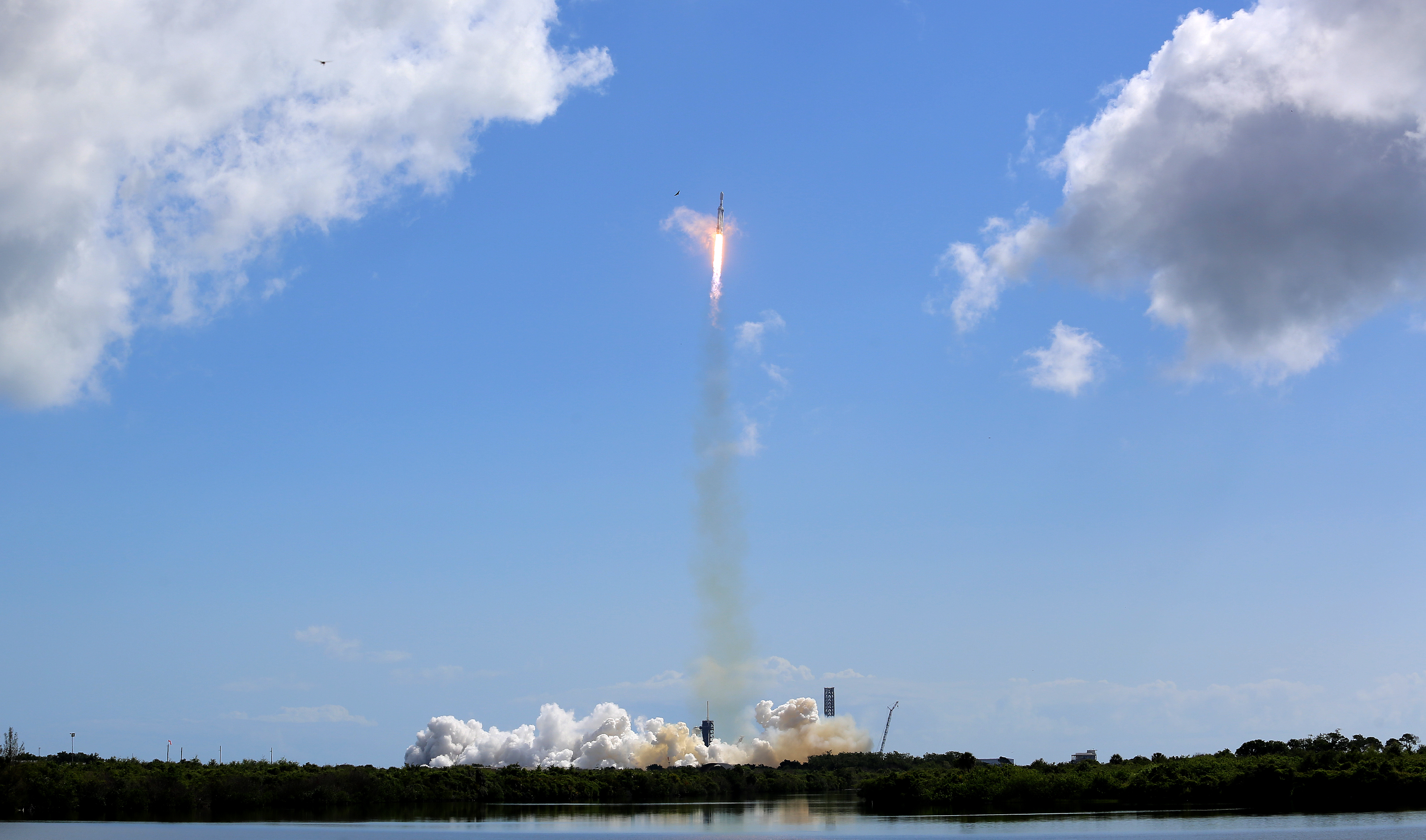 A SpaceX Falcon Heavy rocket launches from Kennedy Space Center's...