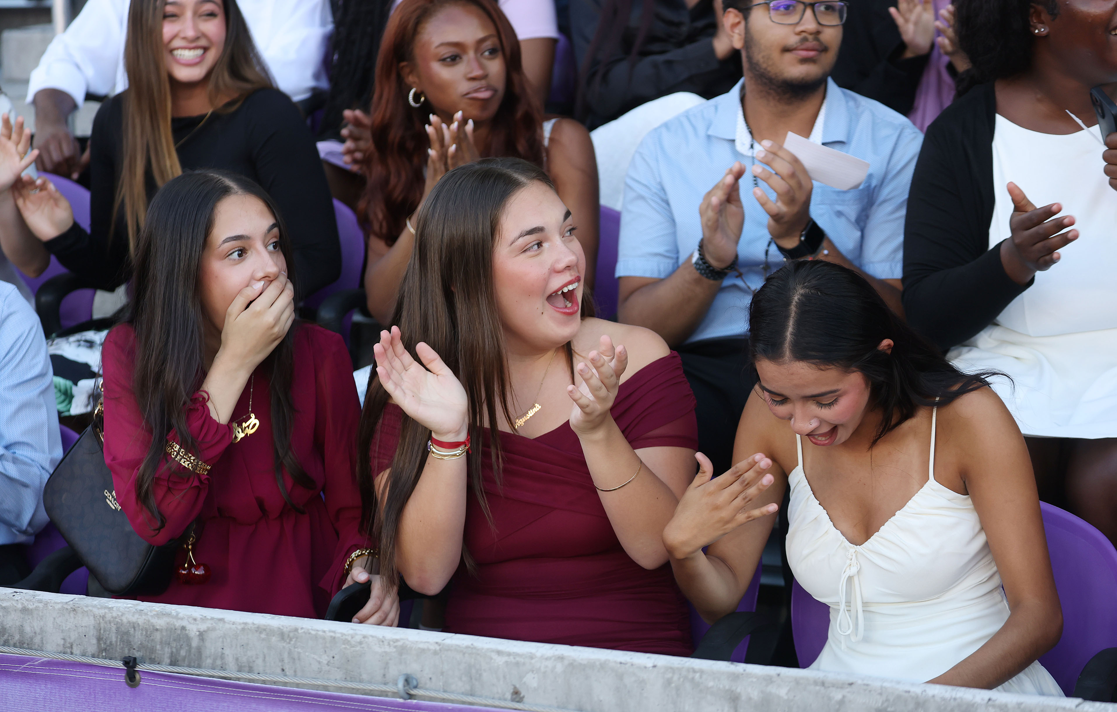 Graduates react with awe and joy as it is announced...