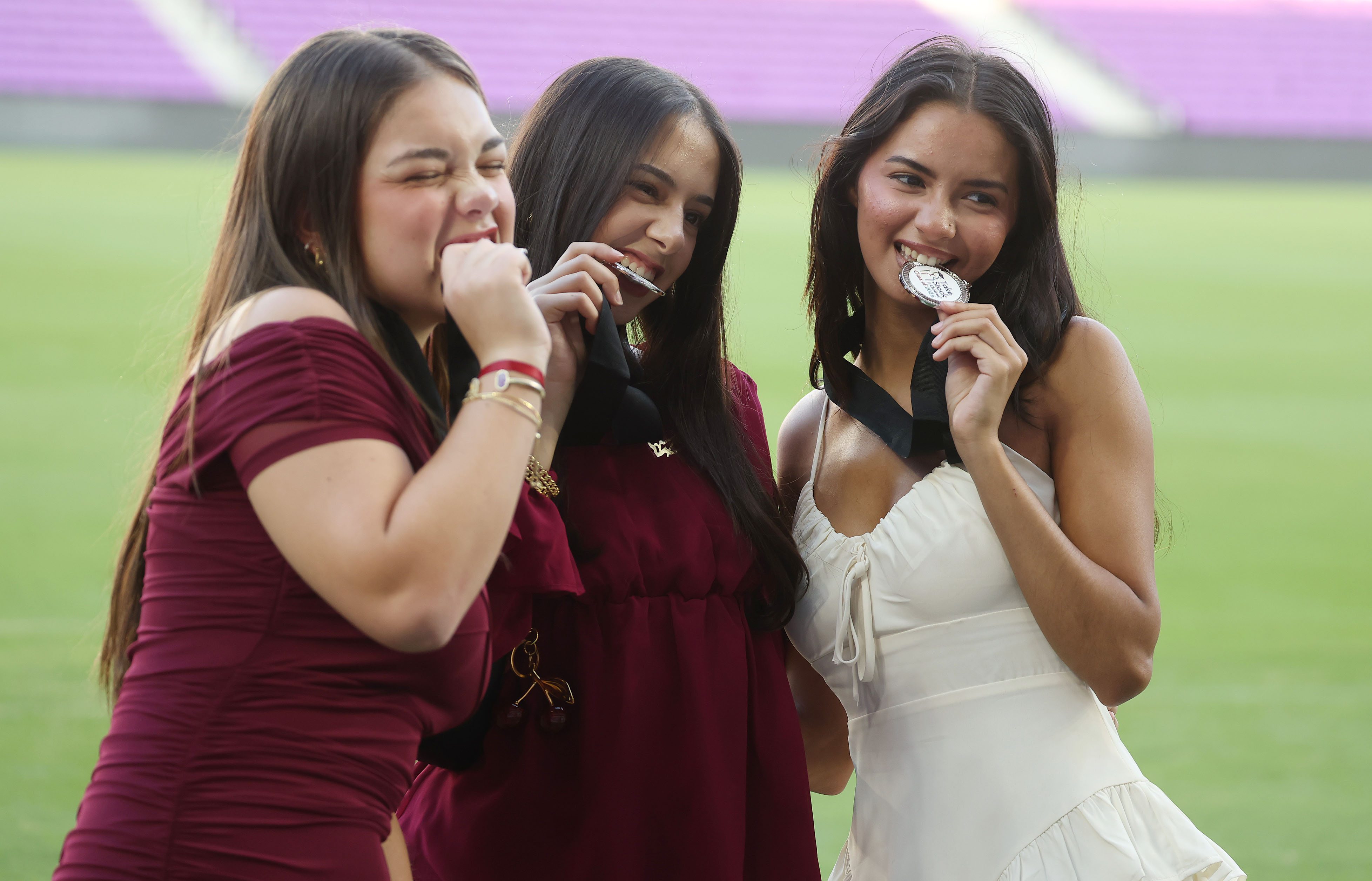 Graduates pose for photos during the Take Stock In Children...