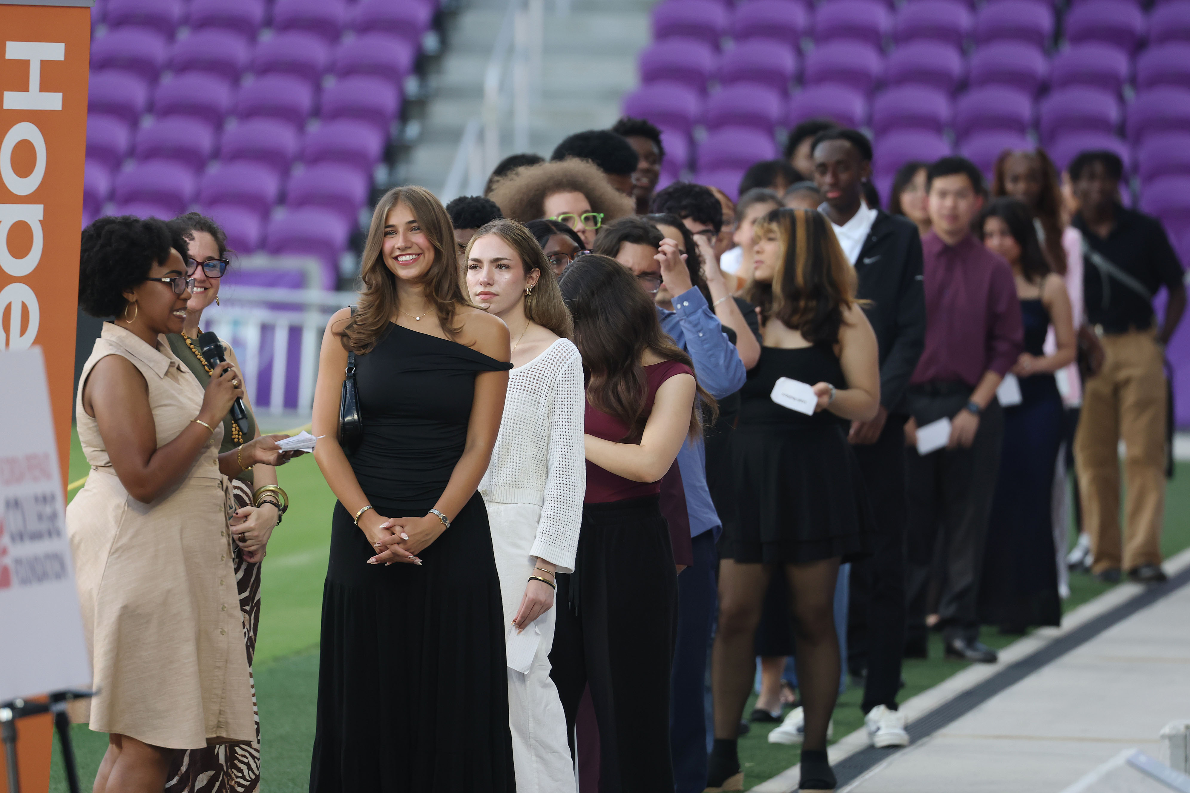 Graduates wait to receive their diplomas during the Take Stock...