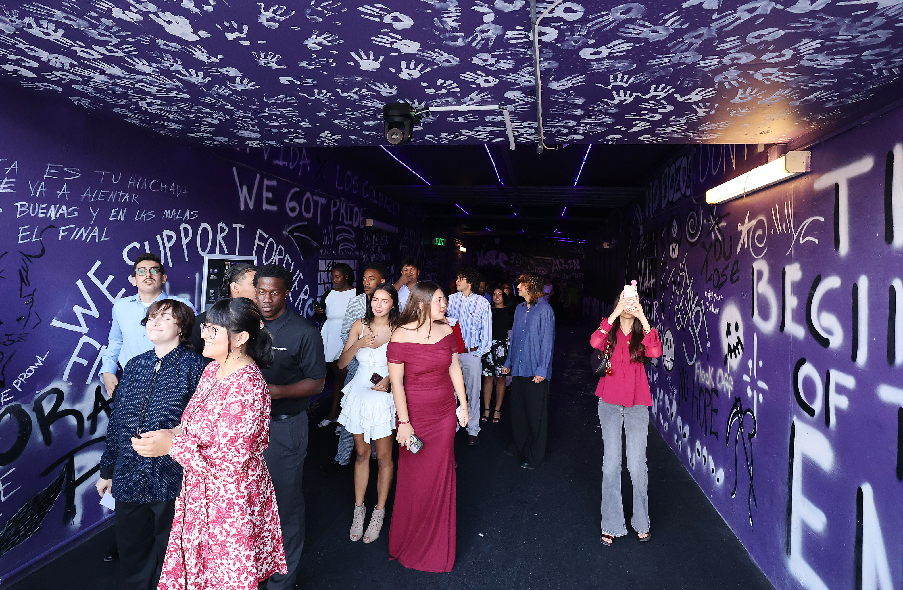 Graduates wait in the Orlando City/Orlando Pride players tunnel before...