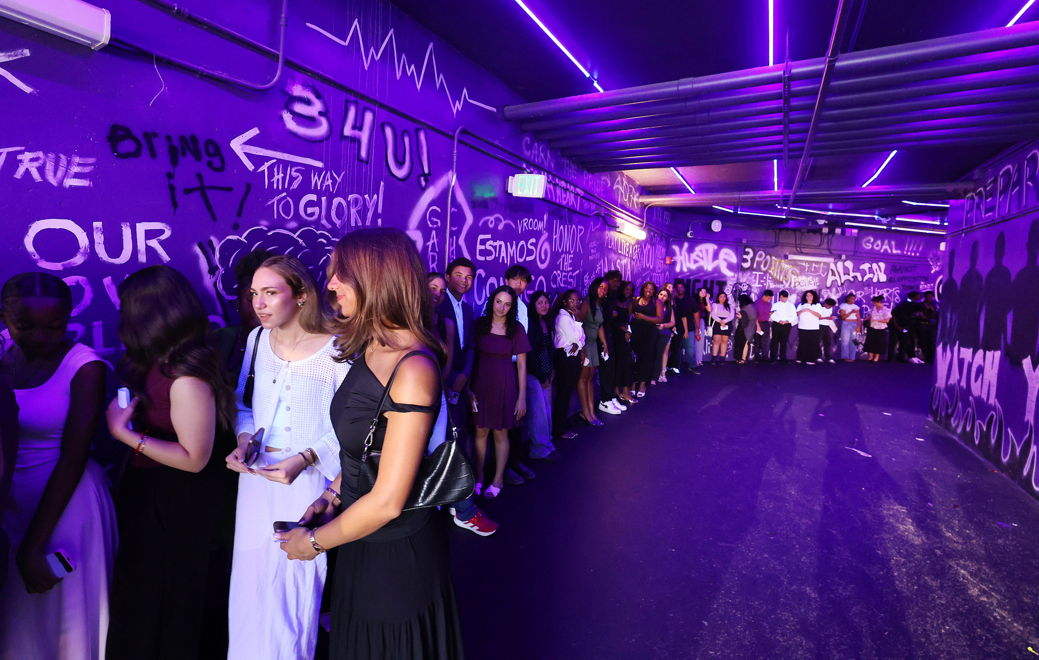 Graduates wait in the Orlando City/Orlando Pride players tunnel before...