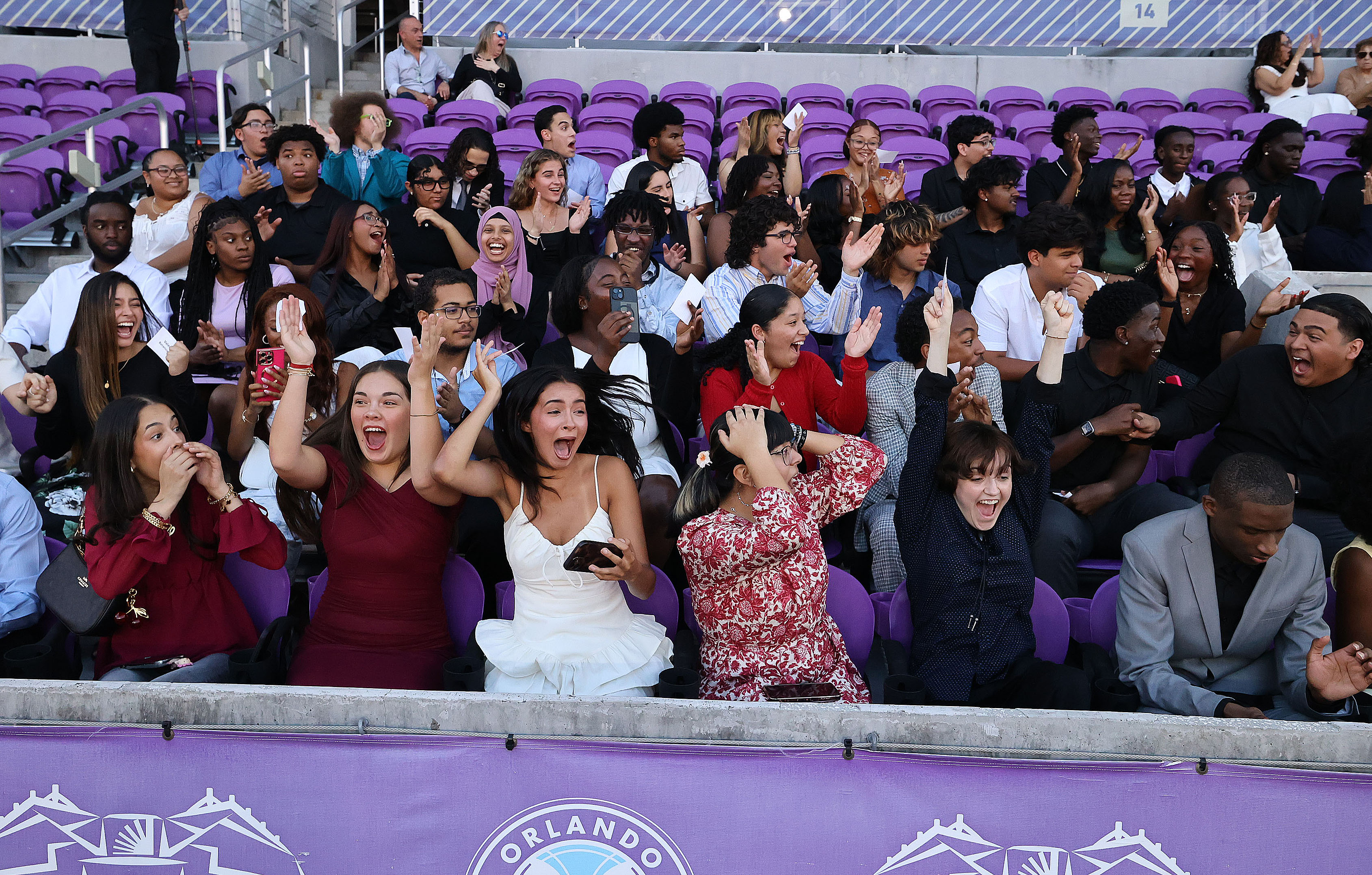 Graduates react with awe and joy as it is announced...