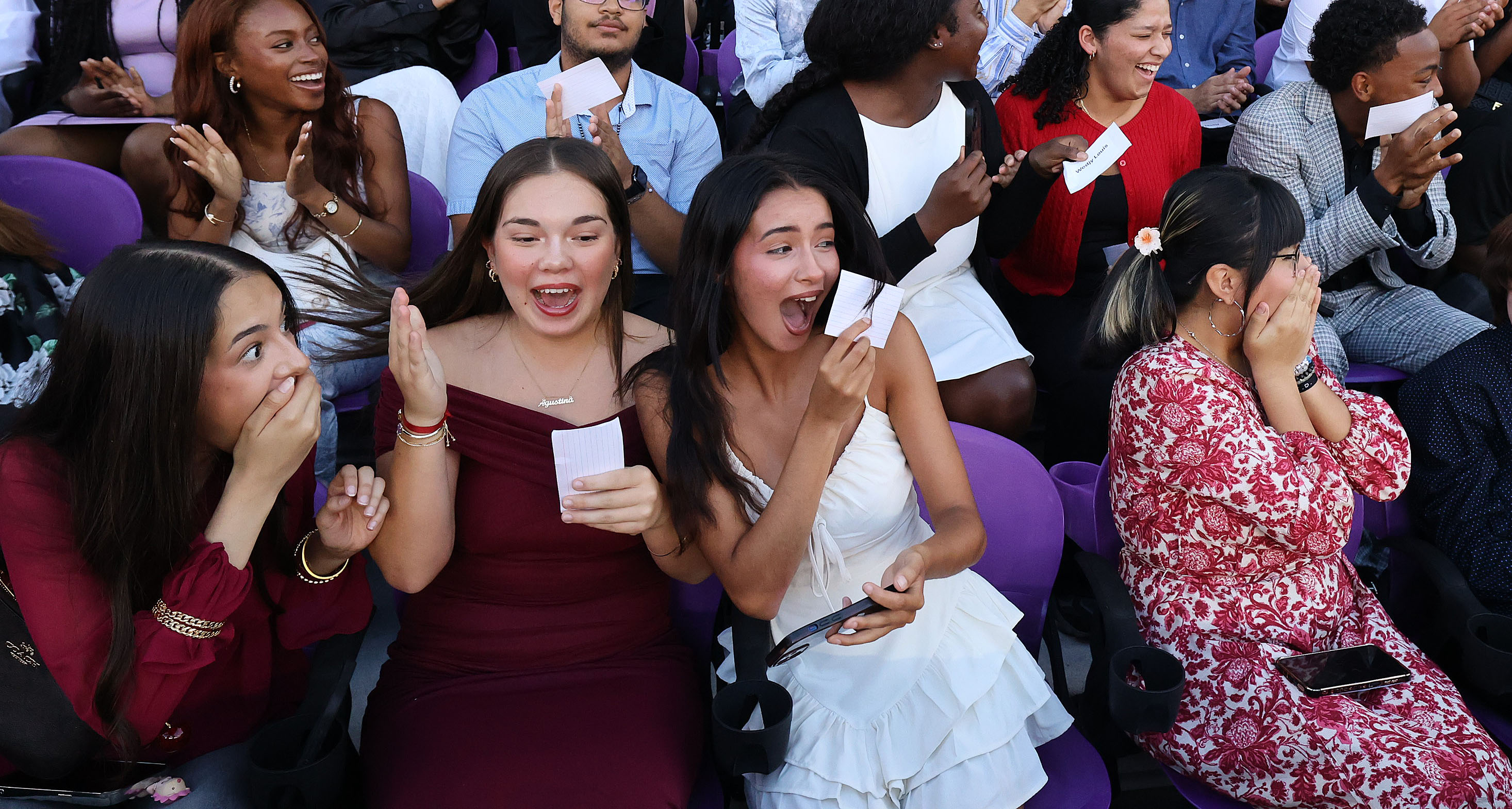 Graduates react with awe and joy as it is announced...