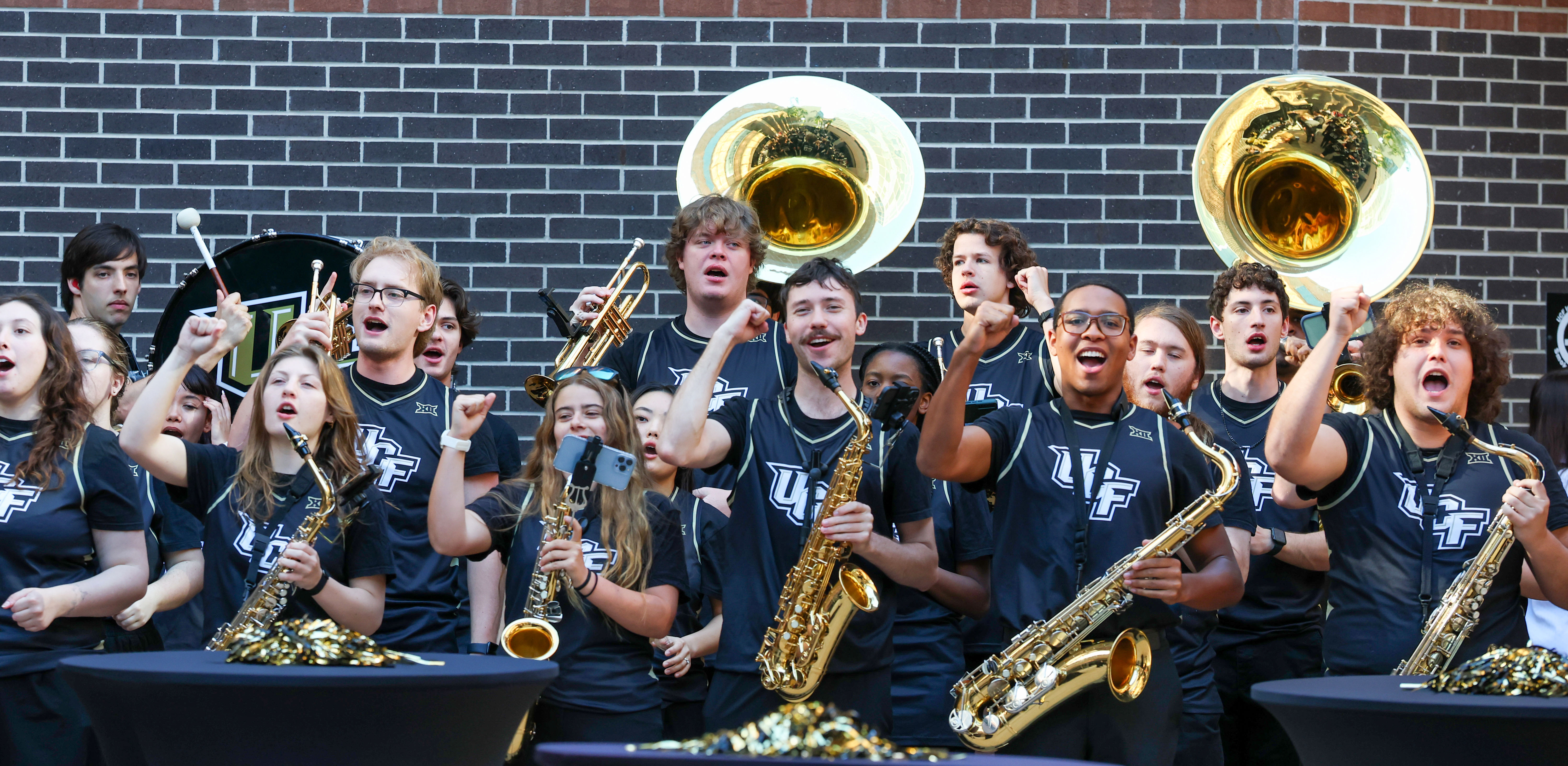 University of Central Florida band members cheer Barry Miller for...