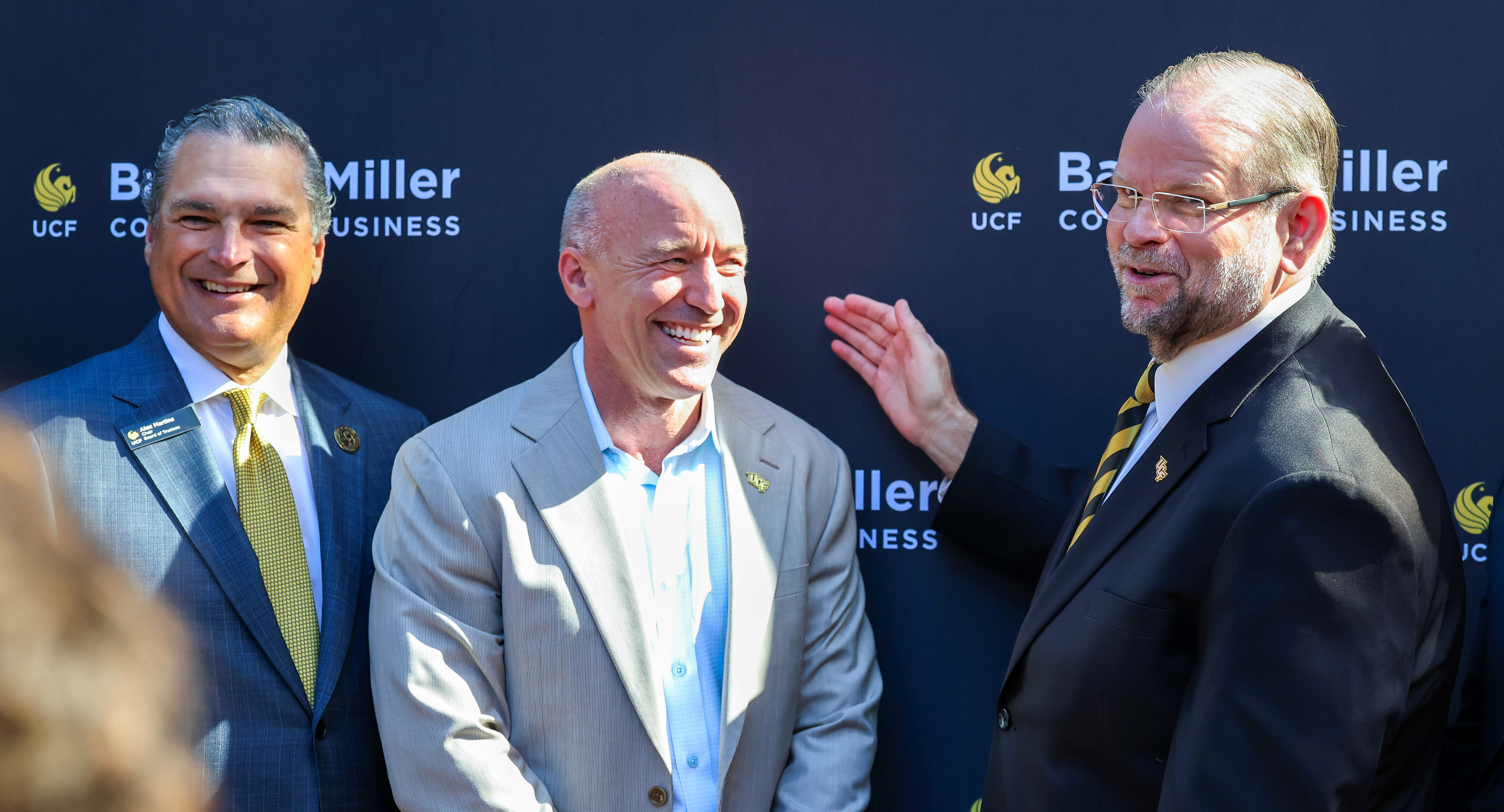 UCF president Alexander Cartwright, right, thanks Barry Miller, with University...