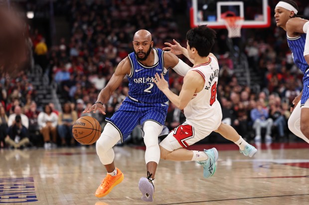 Jevon Carter #2 of the Orlando Magic is fouled by Yuki Kawamura #8 of the Chicago Bulls during the first half at the United Center on April 10, 2026 in Chicago, Illinois. NOTE TO USER: User expressly acknowledges and agrees that, by downloading and or using this photograph, User is consenting to the terms and conditions of the Getty Images License Agreement. (Photo by Geoff Stellfox/Getty Images)