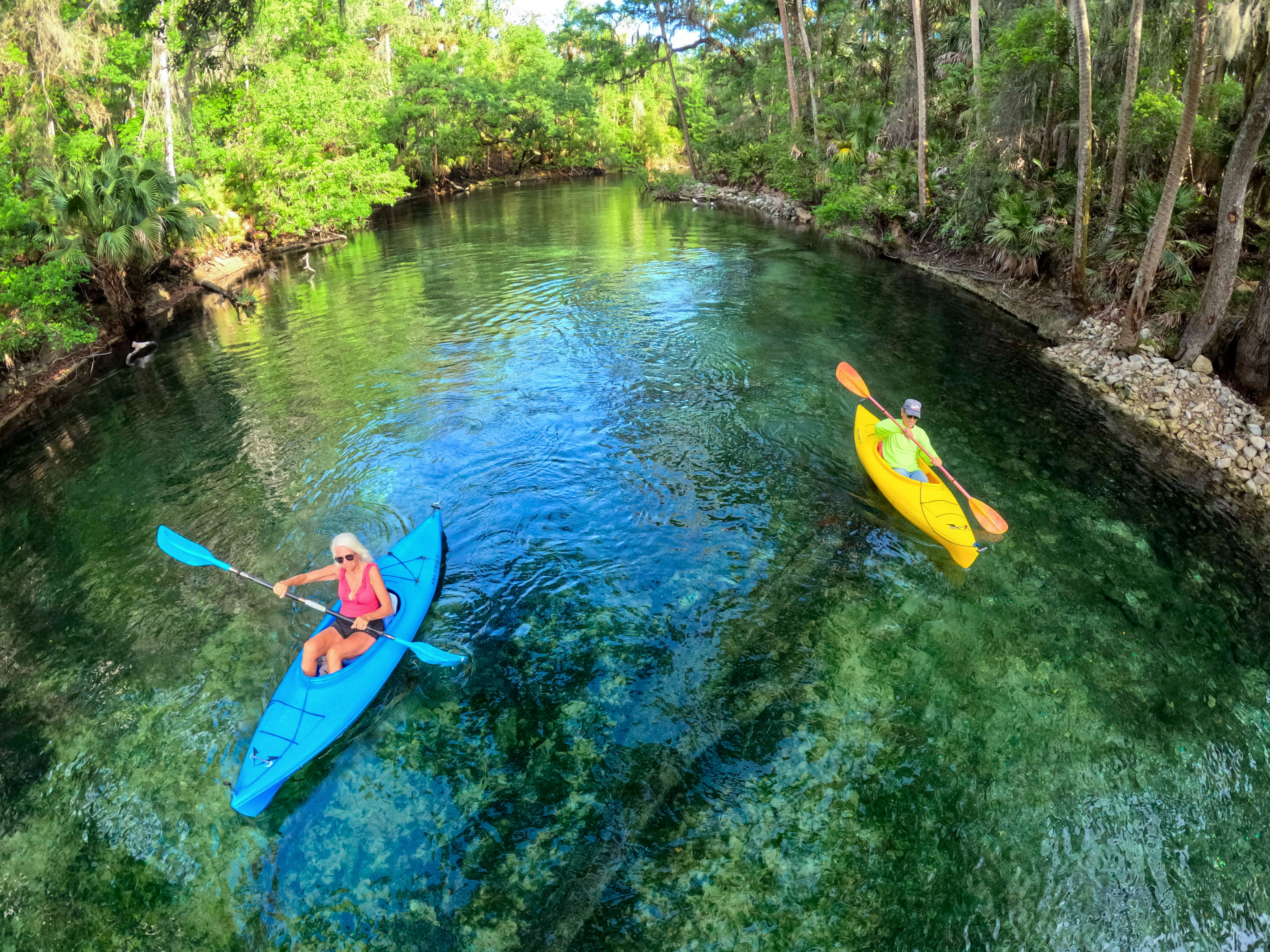 ENJOYING THE BLUE â Kayakers navigate down the run at...