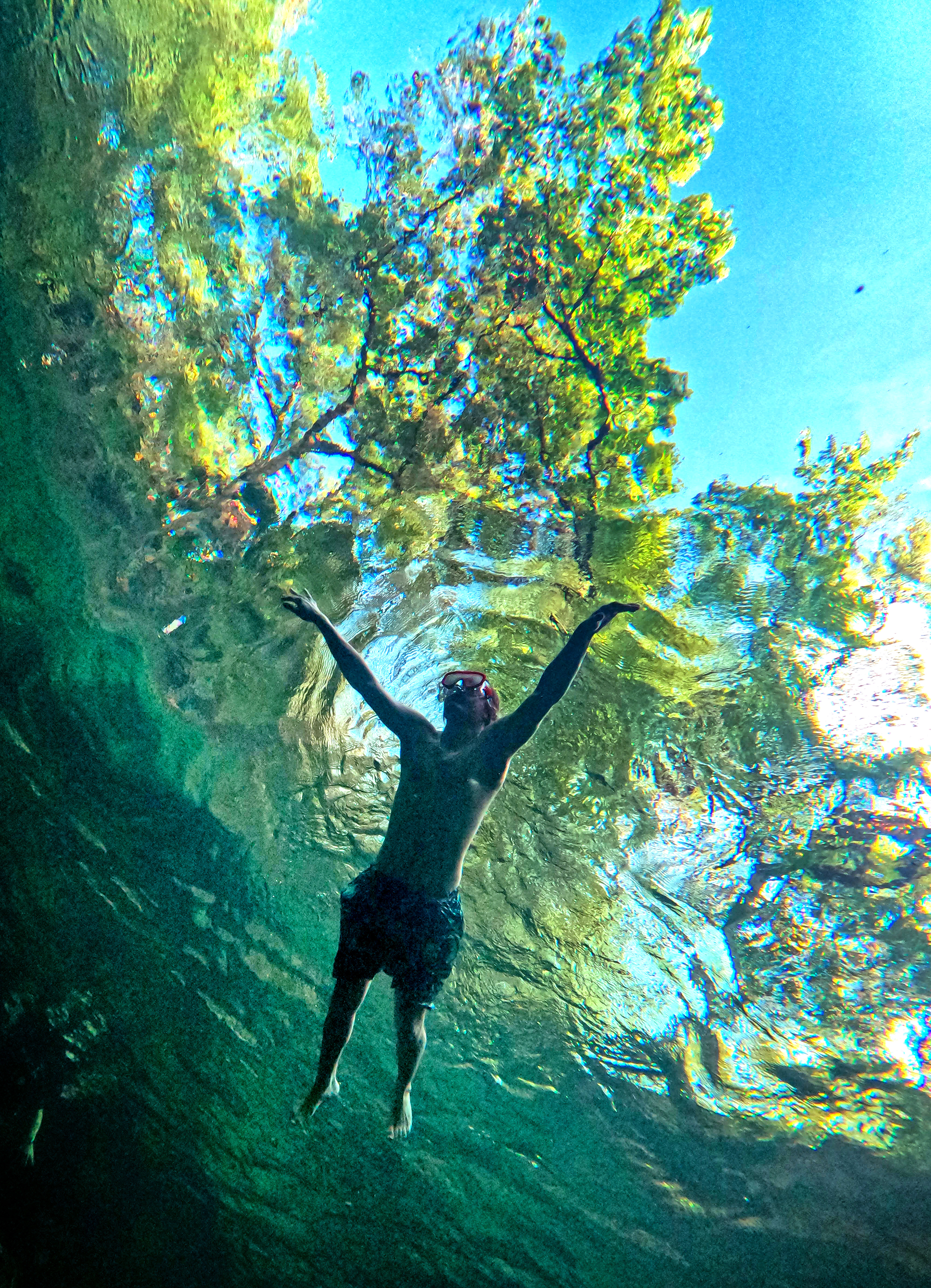 SNORKELING THE BLUE â A snorkeler passes over the boil...