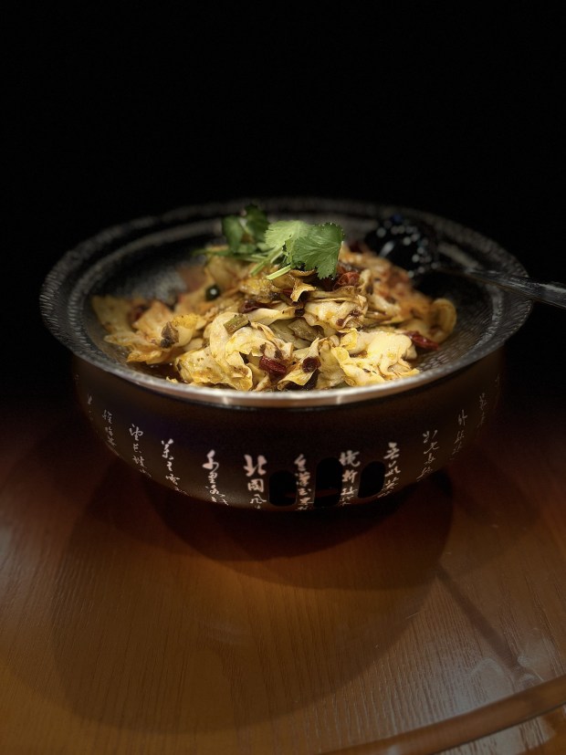 Who says cabbage isn't dramatic? Chuan Fu's stunning, sizzling dry pot cabbage. You'll find it at their Michelin Guide-recommended Winter Park restaurant. (Photo courtesy Chuan Fu)