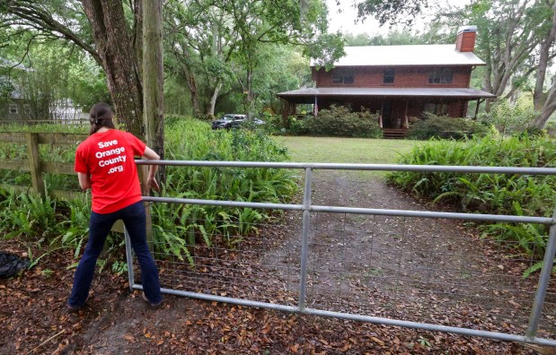 Rachel Hildebrand at her rural home on Chuluota Road in east Orange County, Wednesday, April 8, 2026. Hildebrand is fighting plans for an 1,800-home development proposed for the cattle pastureland across from her home. (Joe Burbank/Orlando Sentinel)