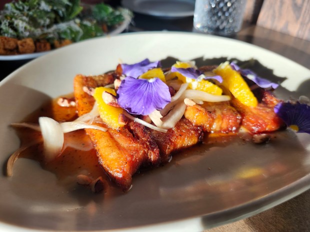 The pork belly dish, done with some Asian flair, is one that regulars have locked onto, says Corner Chophouse Chef Nick Billings. (Amy Drew Thompson/Orlando Sentinel)