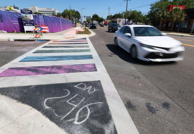 The number of days since the Florida Department of Transportation removed the rainbow-colored crosswalk at the Pulse nightclub memorial site is indicated with chalk outside the former club, Friday, April 24, 2026. Orange-Osceola State Attorney Monique Worrell announced Friday she will not pursue charges in the case. (Joe Burbank/Orlando Sentinel)